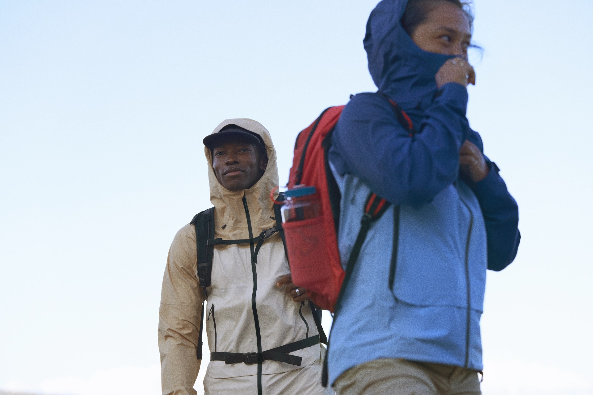 the north face athletes in futurelight jackets hiking