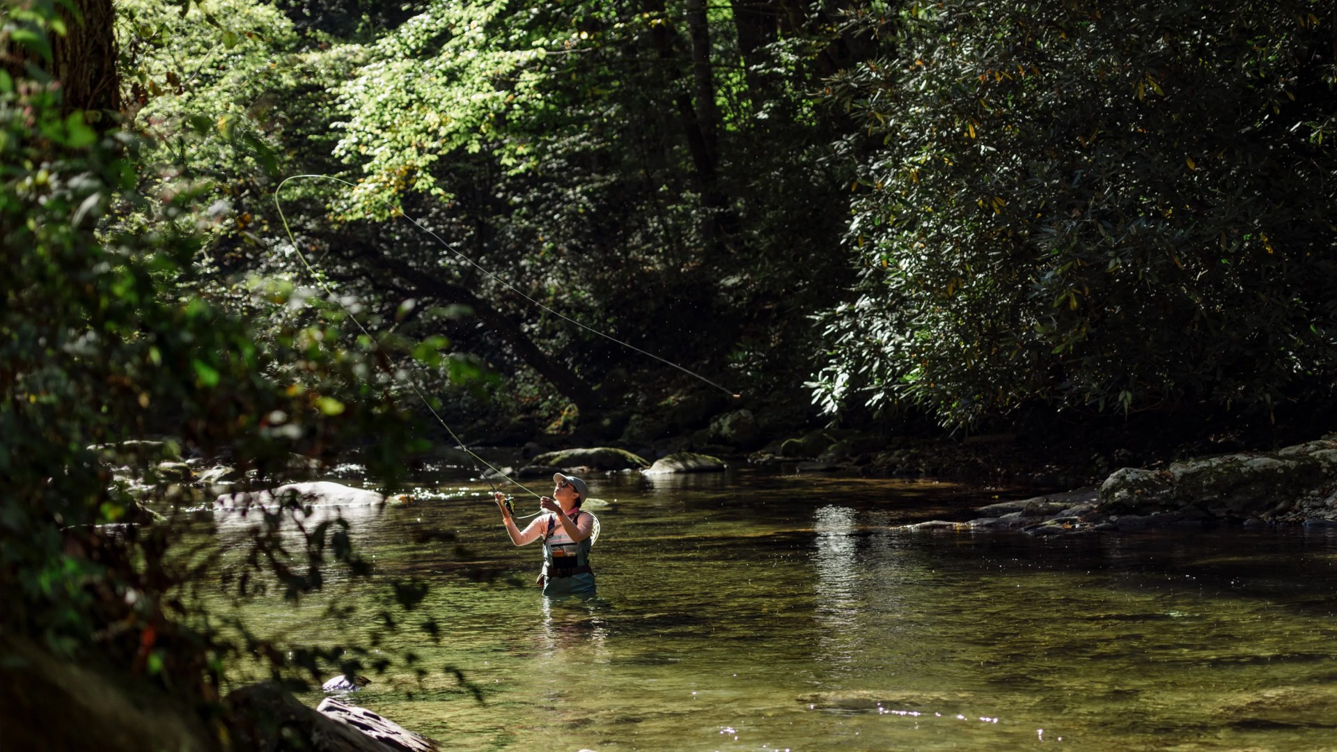 Woman fly fishing in Bryson City during Summer