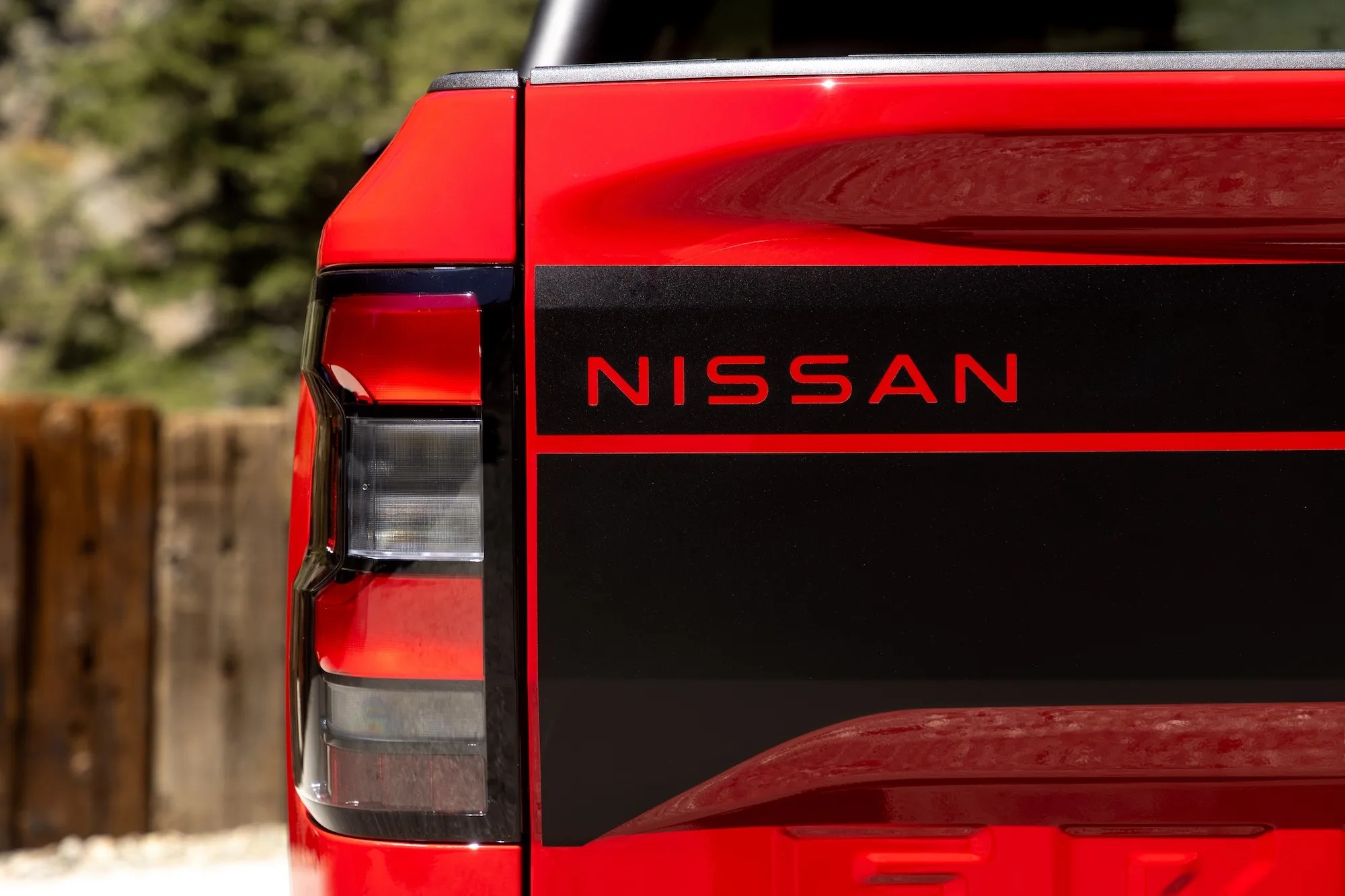 tailgate of a red nissan frontier pickup truck