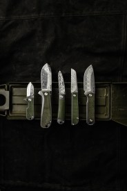 wesn founder's line knives on a green and black background