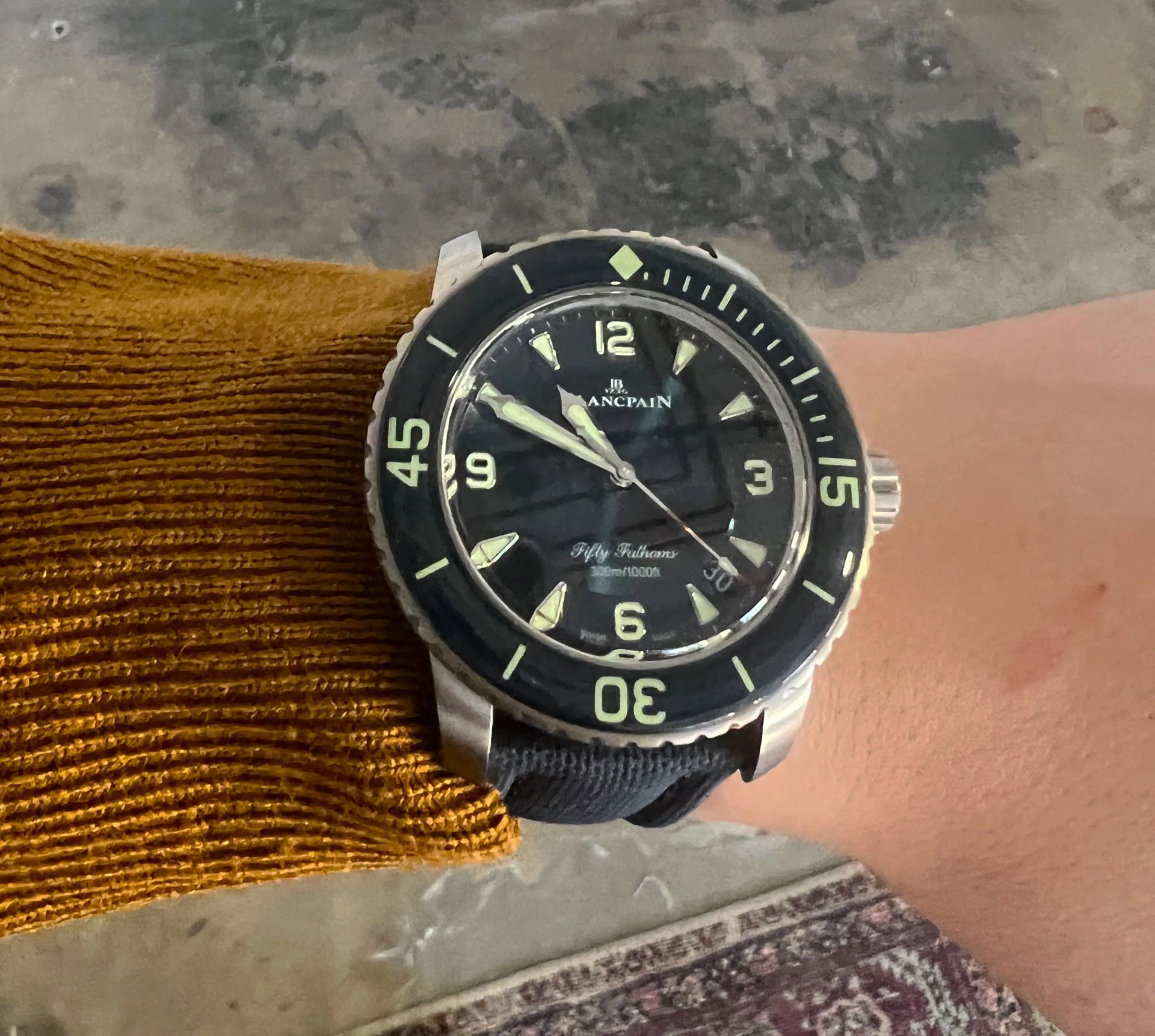 blancpain dive watch on mans wrist