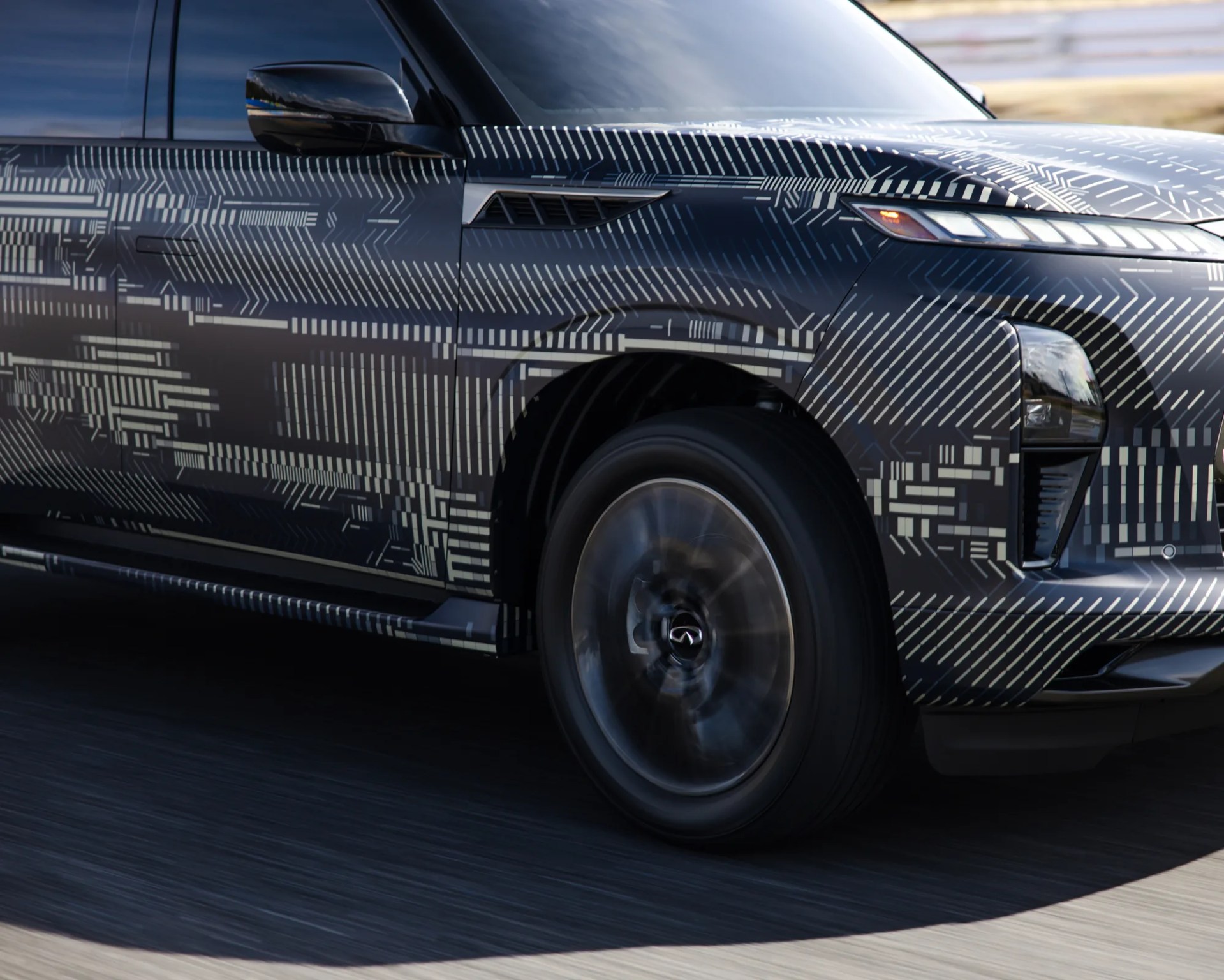 2025 infiniti qx80 front right fender covered in camouflage