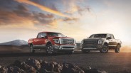 2024 nissan titan and titan xd pickup trucks in the desert at sunset