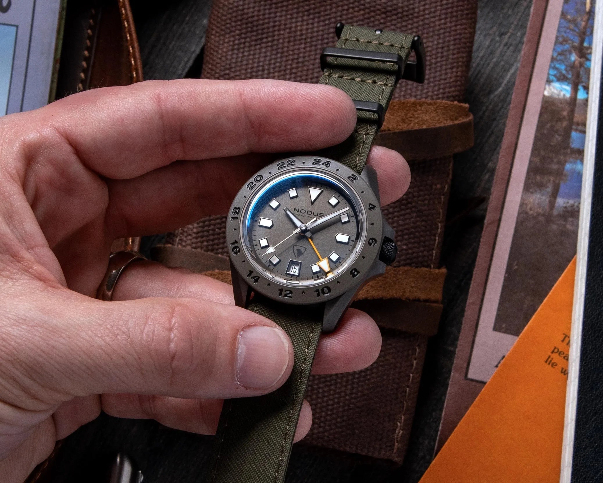 hand holding a nodus x raven tool watch