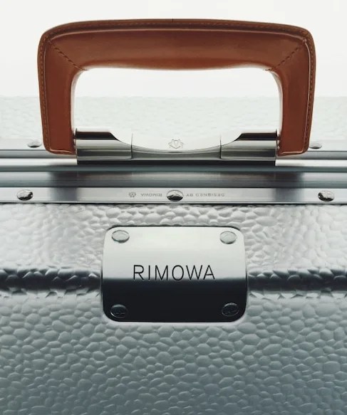 closeup of rimowa hammered aluminum suitcase