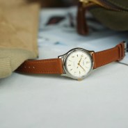 white timex dress watch on a table