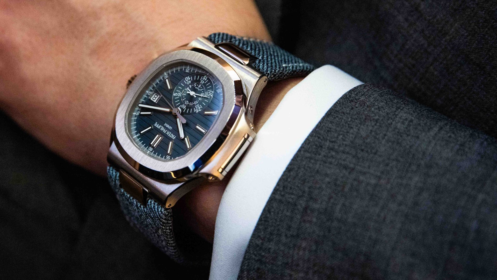 blue patek phillipe watch on man's wrist