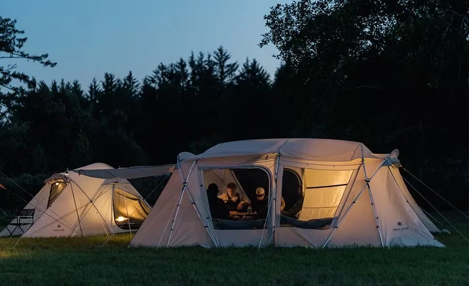 Campers inside tents at night