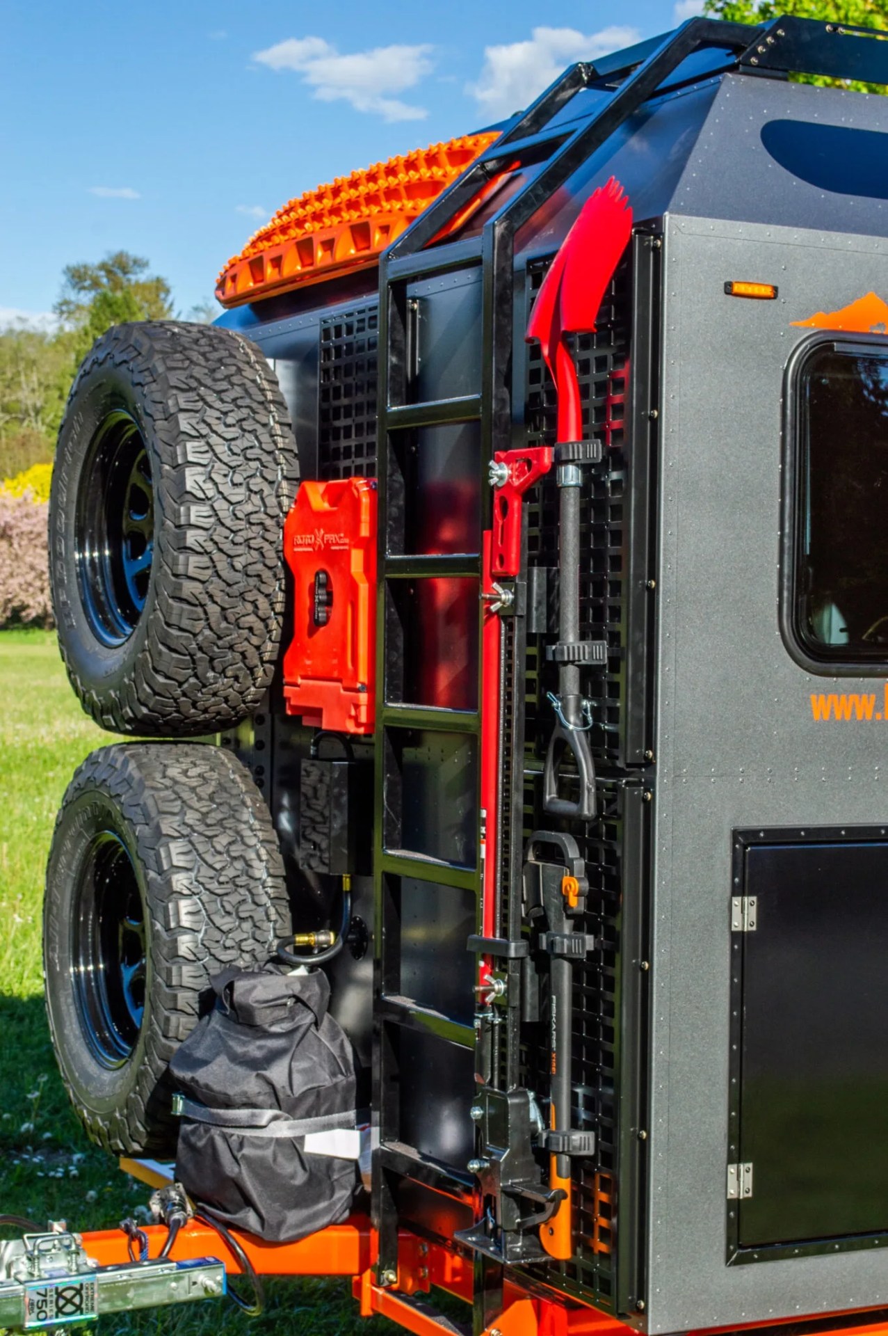 rear of mammoth overland trailer showing ladder and spare tires