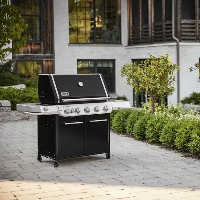 gas grill in backyard