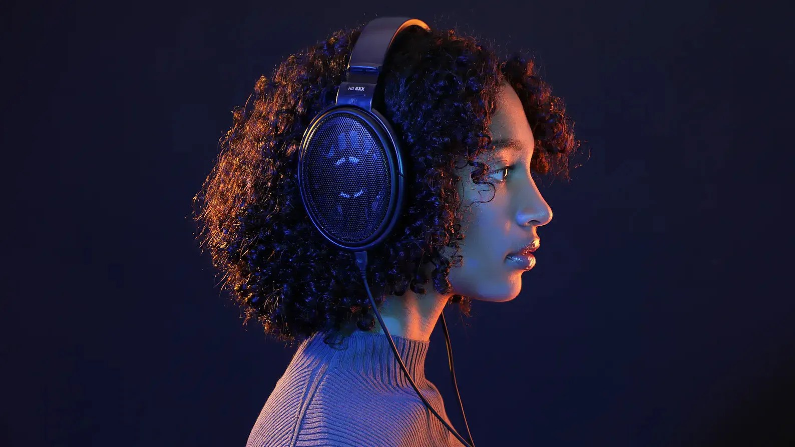 woman wearing a pair of wired headphones