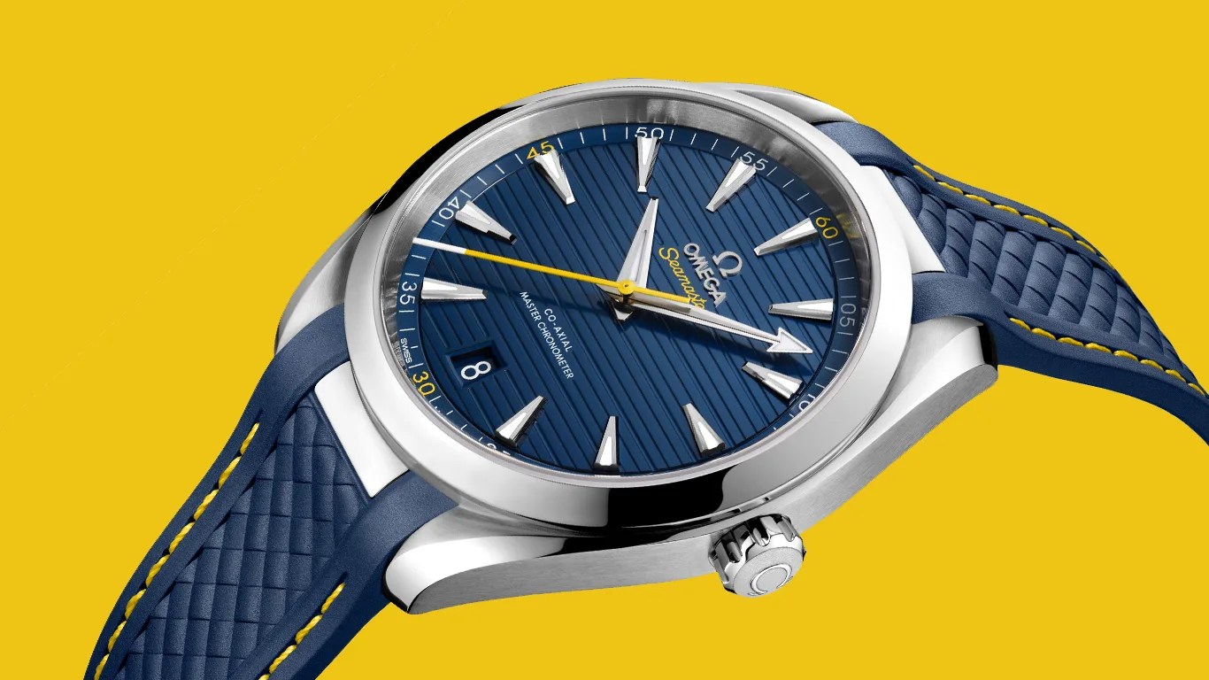 blue omega watch against a yellow background