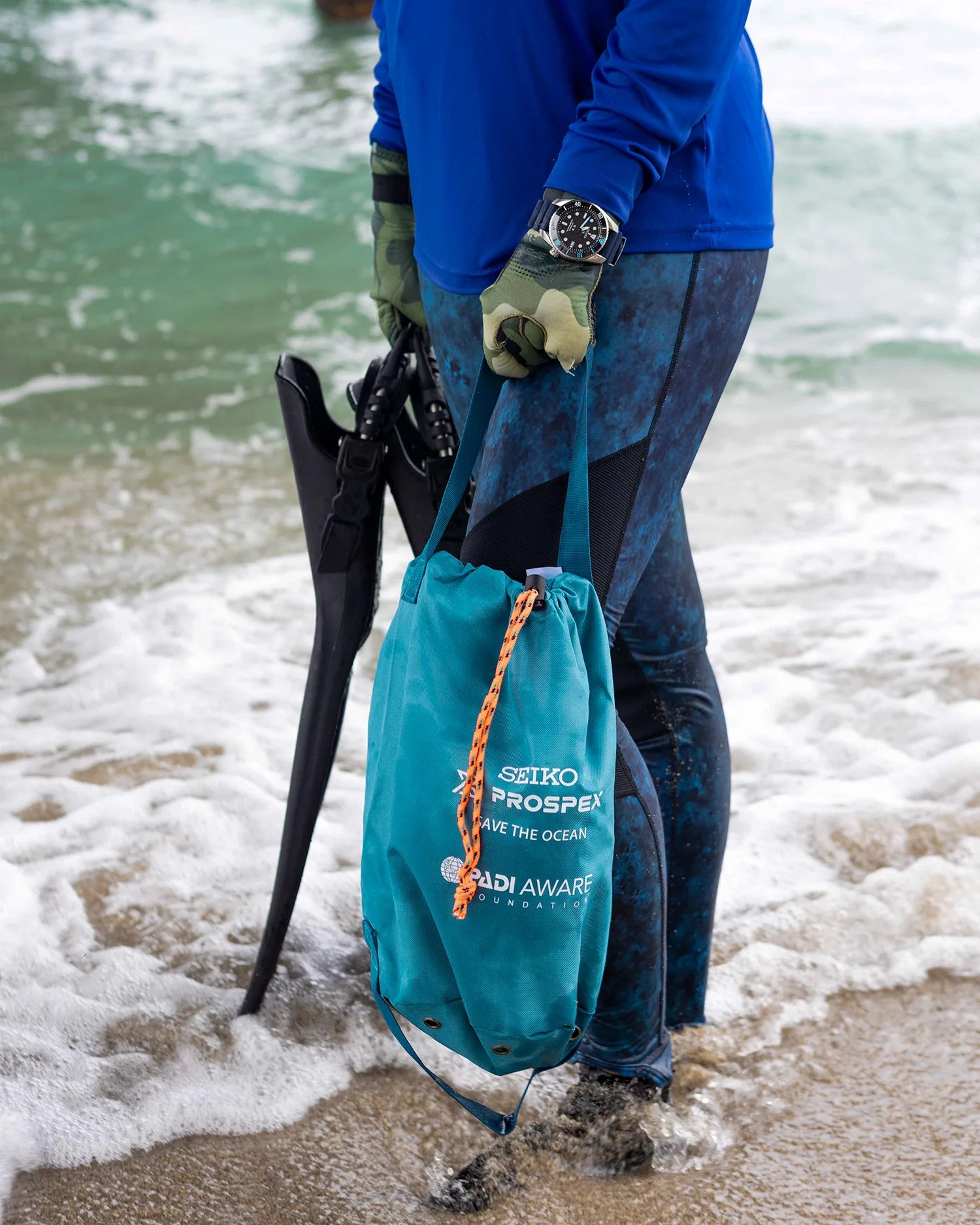scuba diver entering water