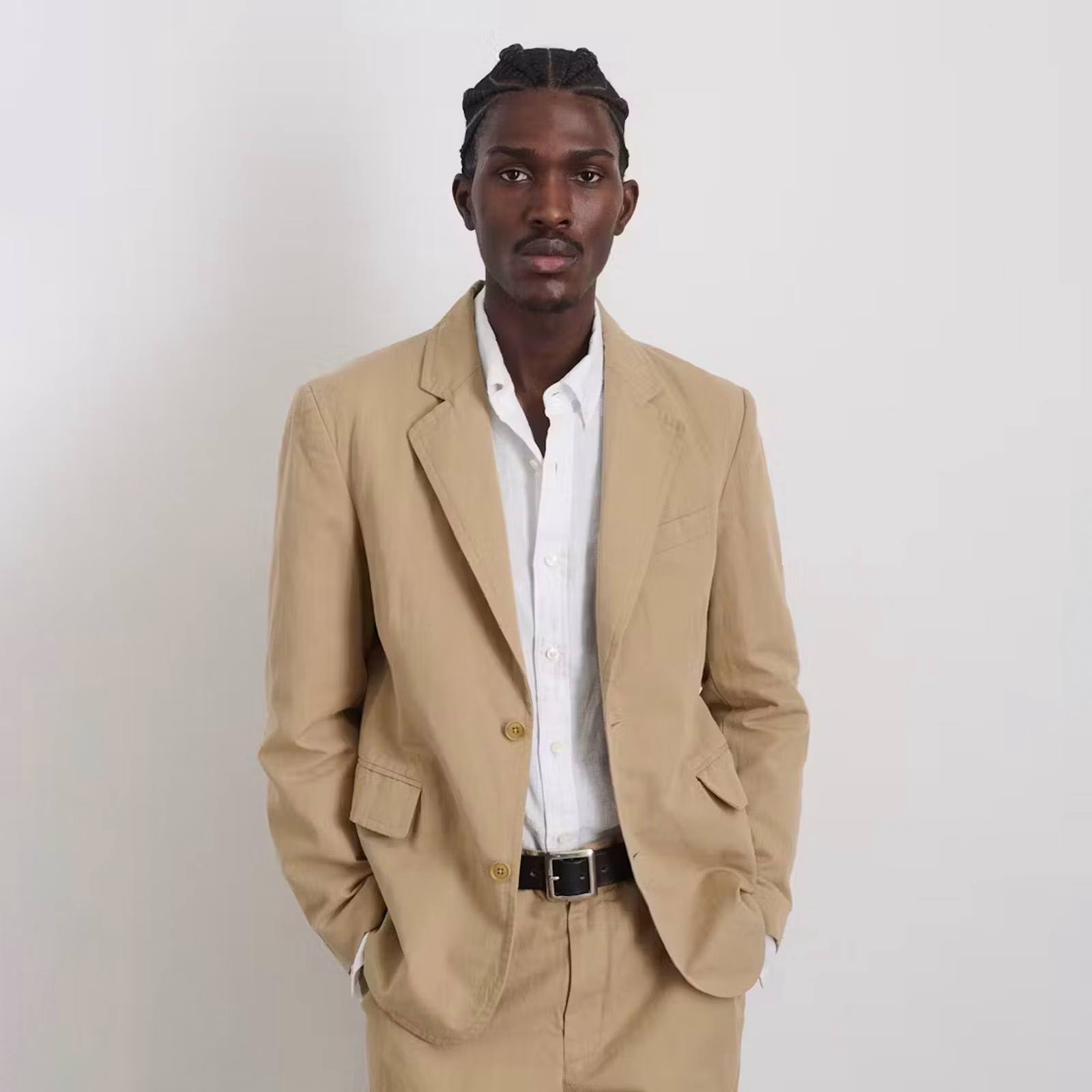 A male model looking forward wearing an Alex Mill Cooper Cotton Linen Blazer in Tan