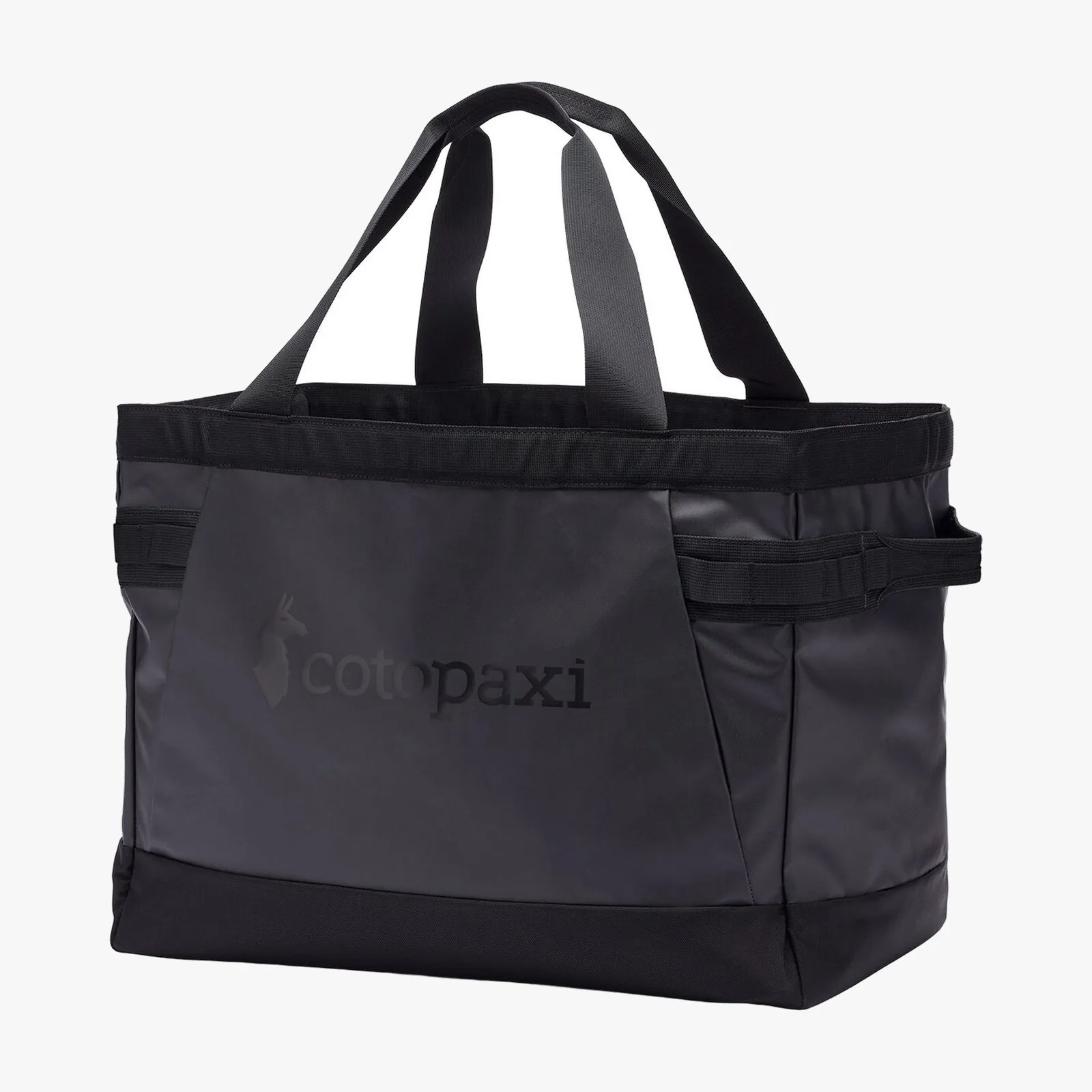 Black Cotopaxi tote bag with dual handles and side loops.