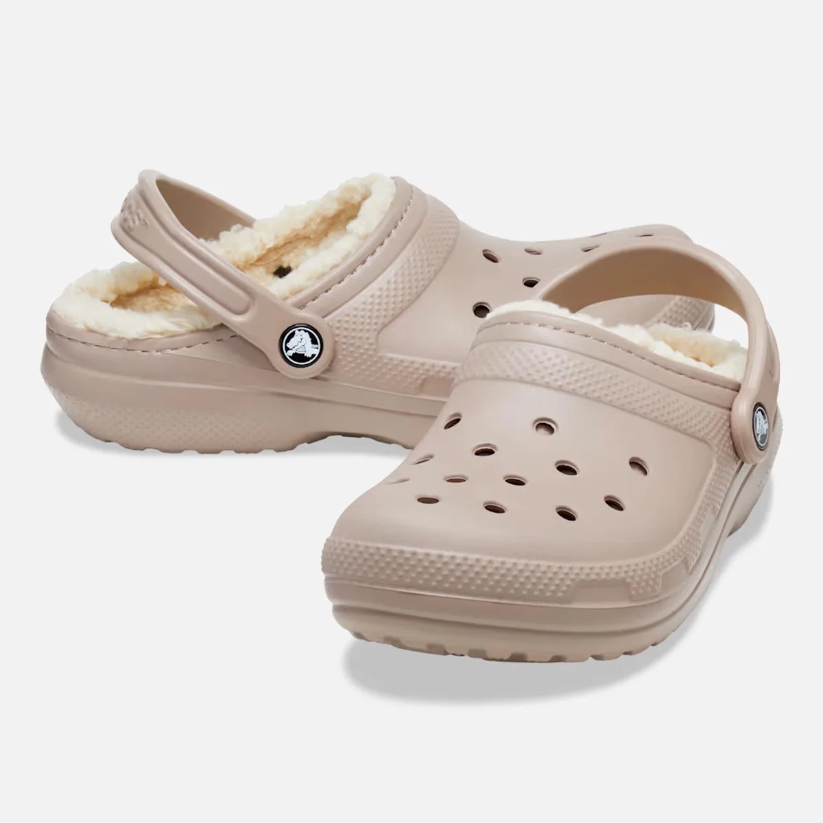 Pair of beige Crocs clogs with cream-colored fleece lining and heel straps.