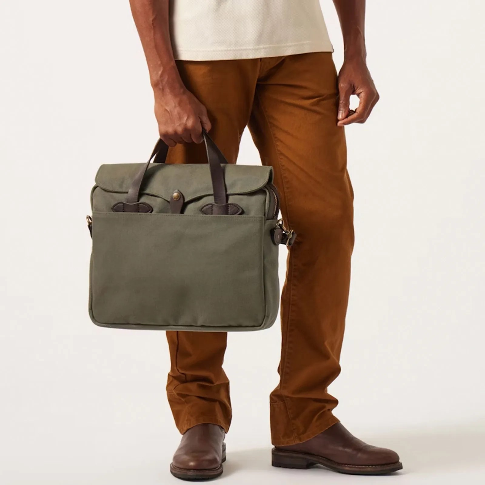 A man with a green canvas briefcase. 