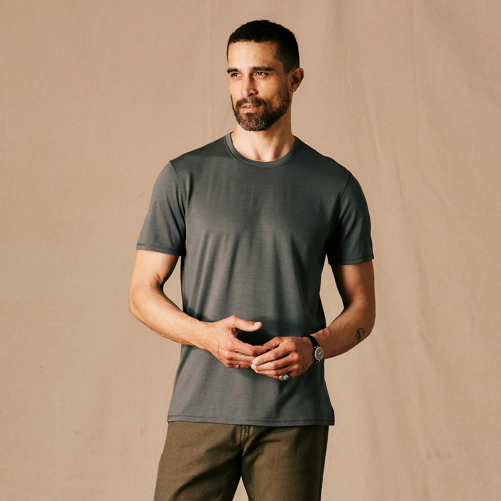 Man wearing a grey Proof 72 hour Merino T-shirt