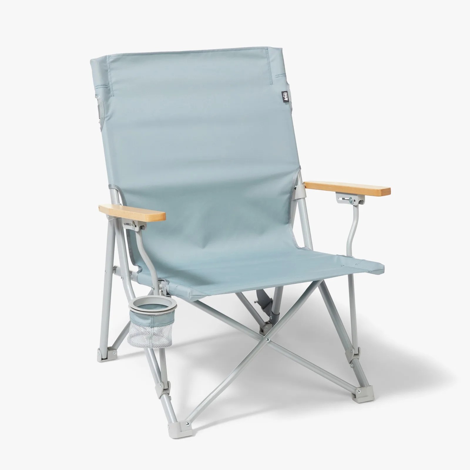 Light blue folding camping chair with wooden armrests and a mesh cup holder attached to the frame.