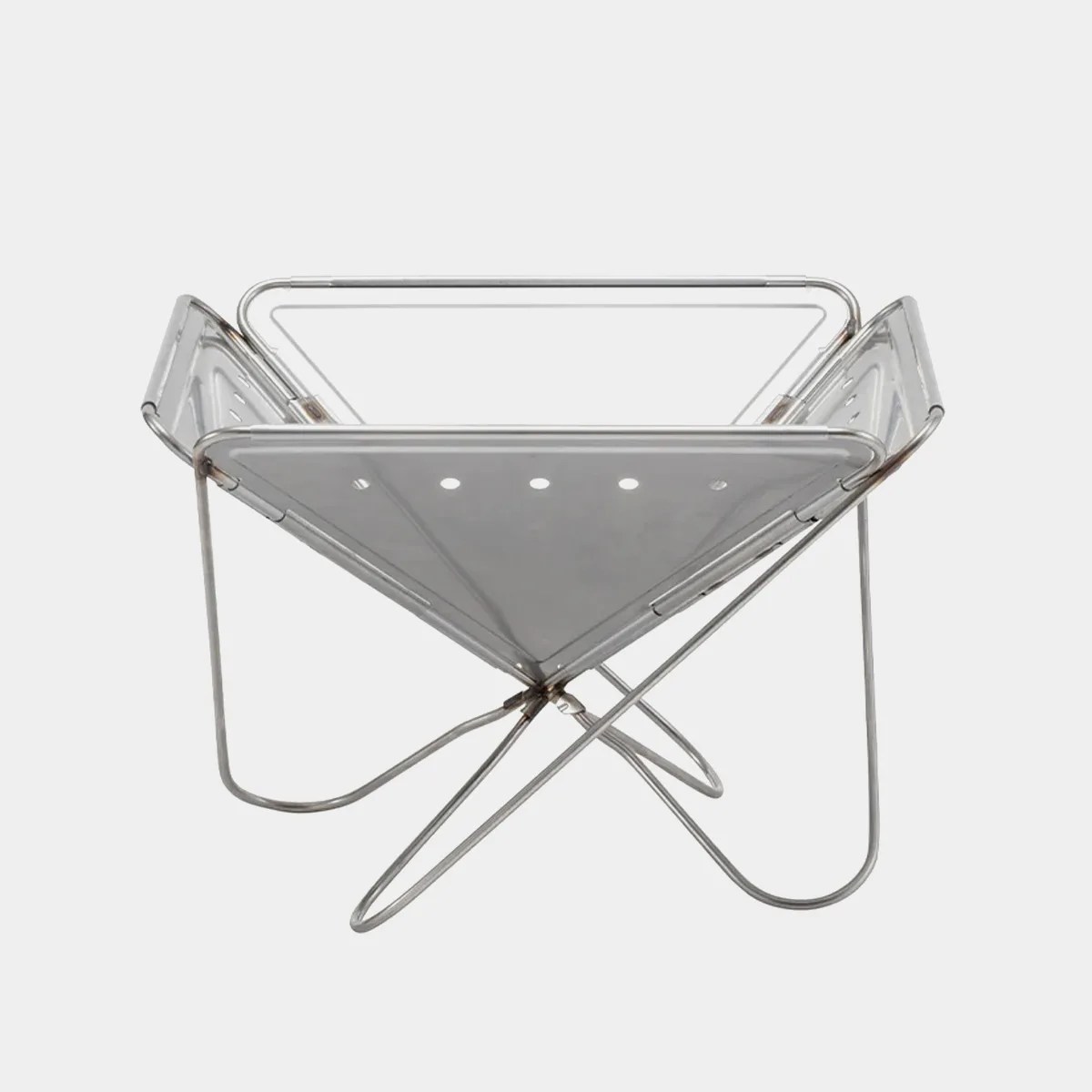 Foldable stainless steel fire pit with triangular shape and perforated sides.