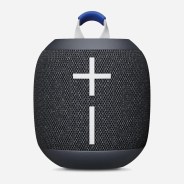 Black portable Bluetooth speaker with large white plus and minus volume buttons and a blue handle loop.