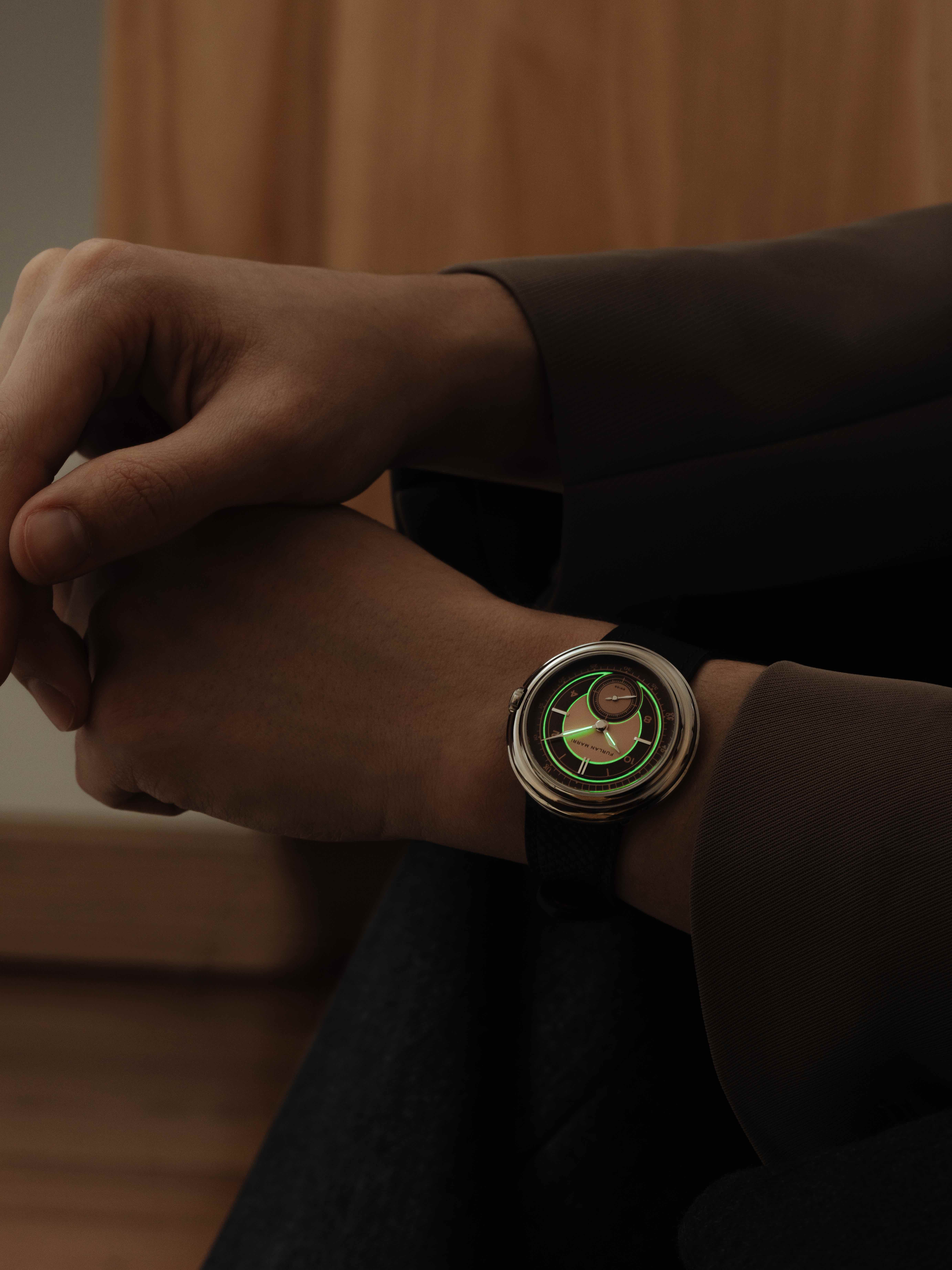 person wearing a furlan marri watch in low light