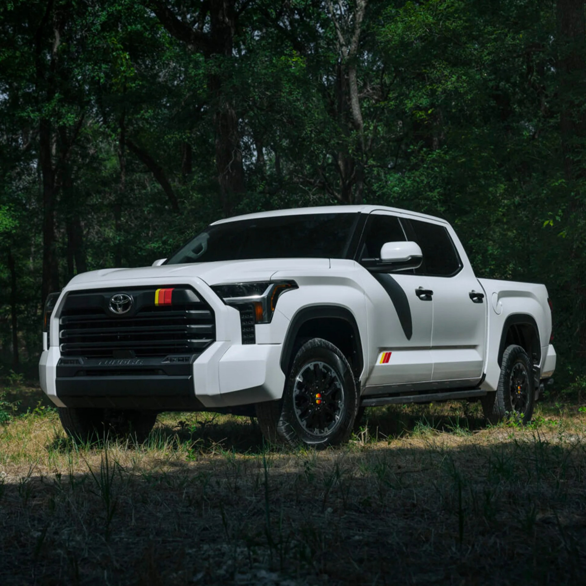 a white toyota pickup truck outdoors