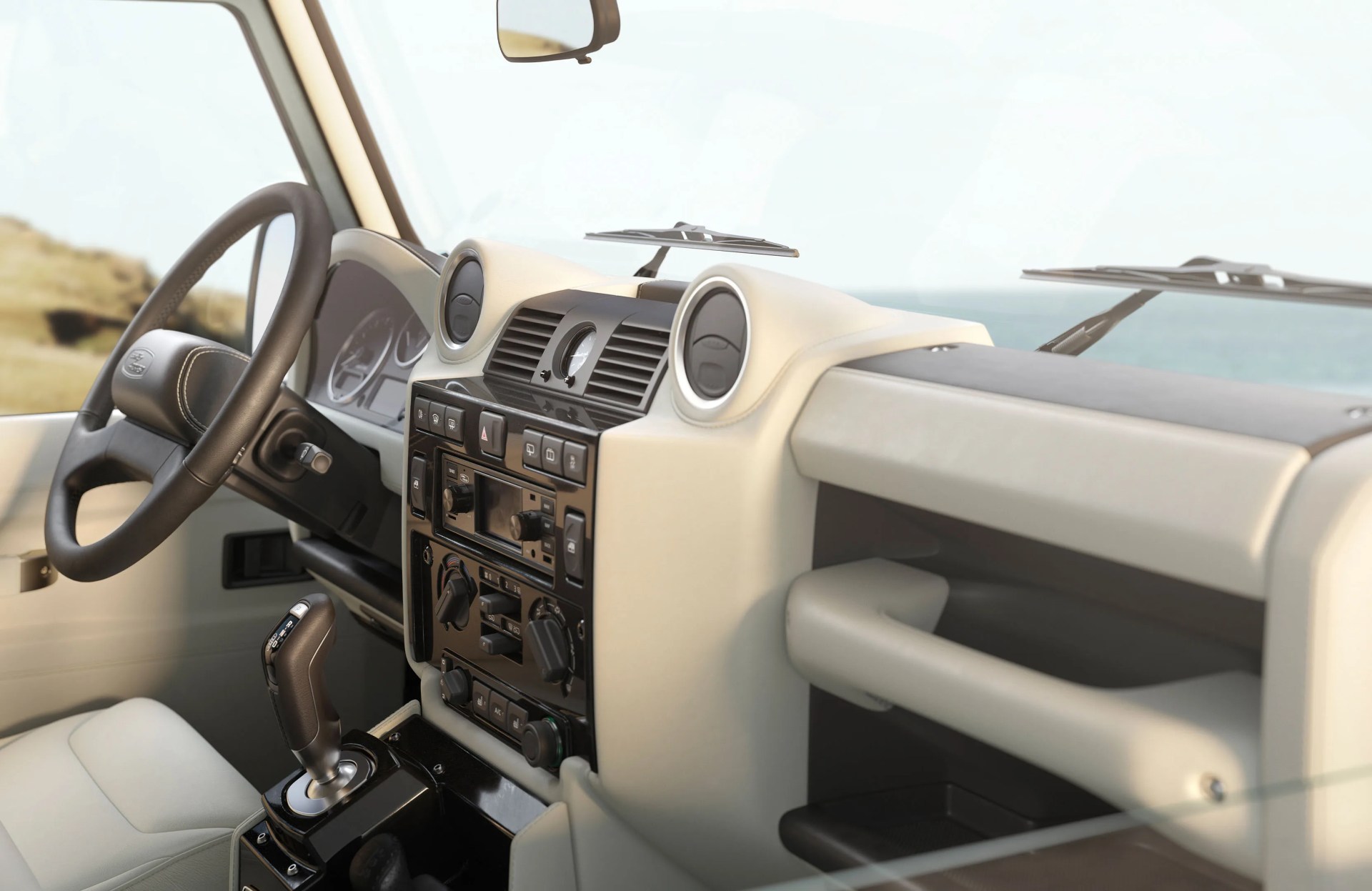 A an interior shot showing the front dash and steering wheel in a restored Land Rover Defender Classic