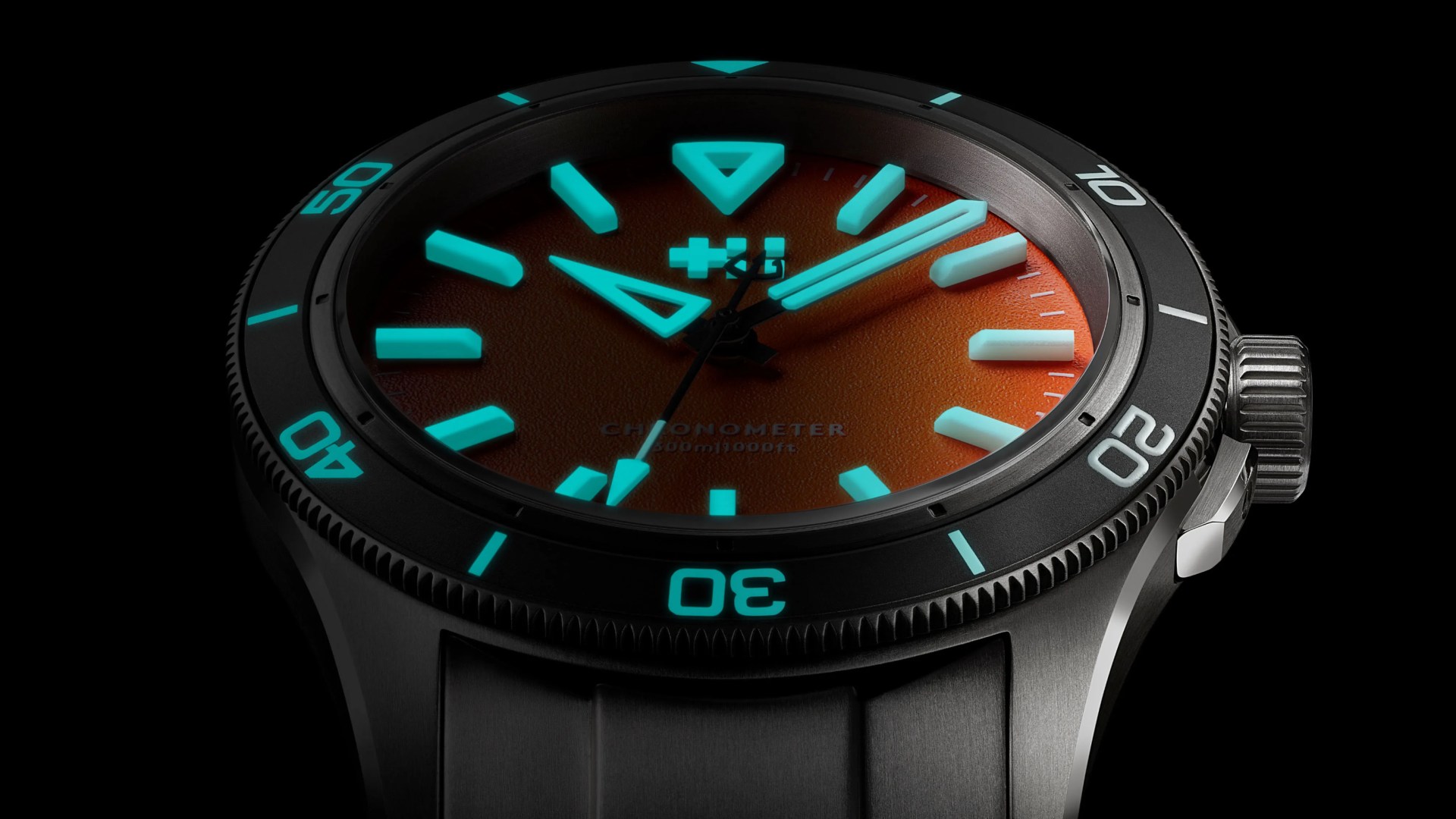 Christopher Ward watch half lit up in the dark