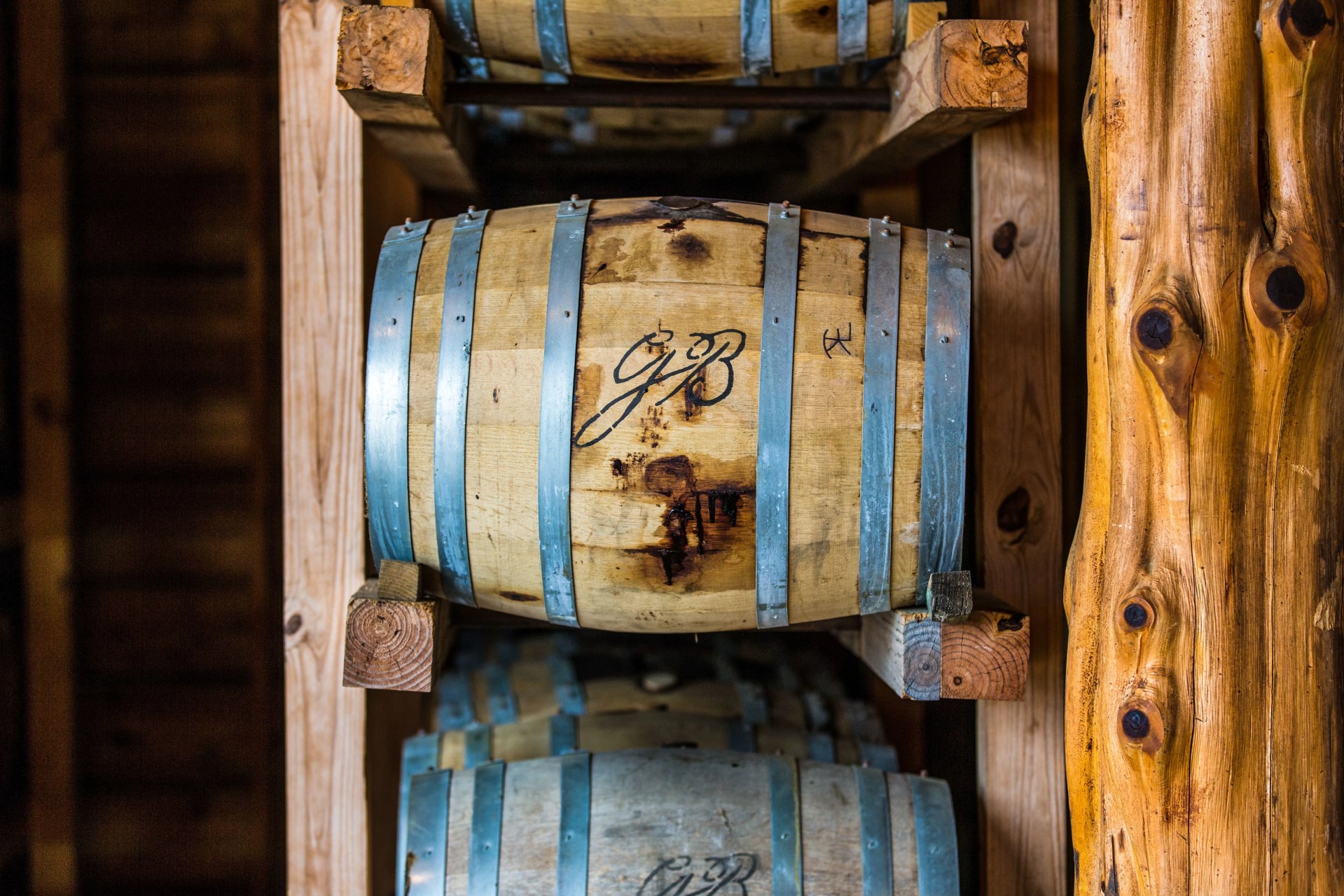 An image of a Garrison Brothers bourbon barrel aging in a rickhouse. 