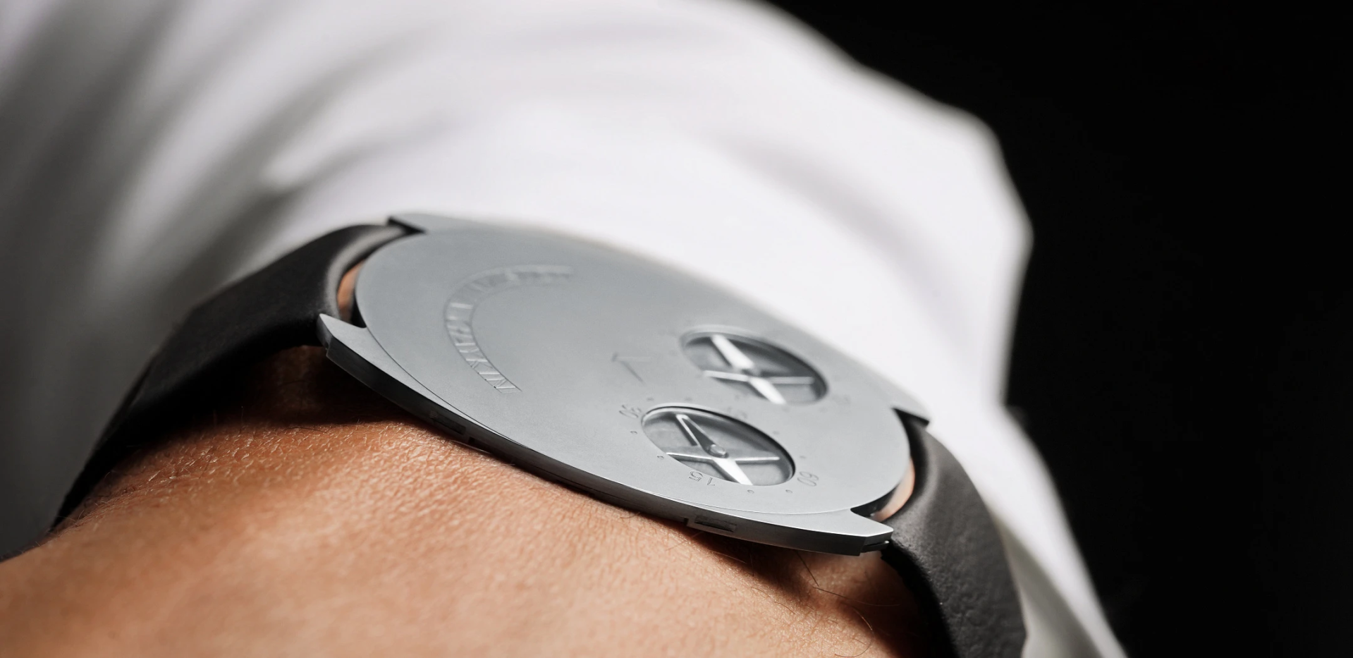 The Konstantin Chaykin ThinKing watch worn on a wrist showed from the side to highlight the timepiece’s recording breaking thinness.