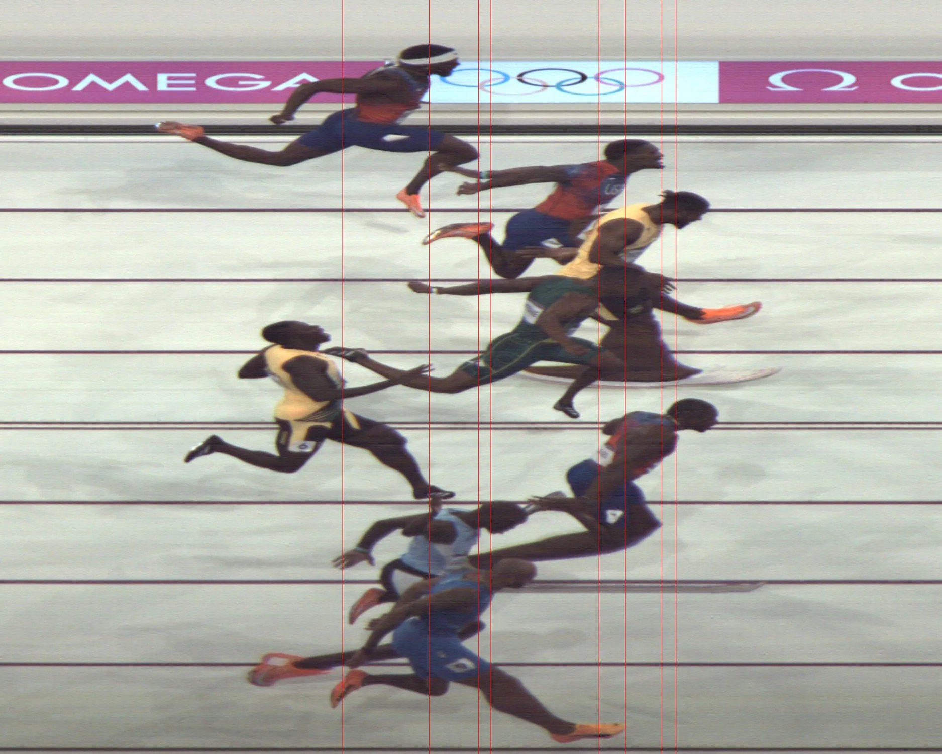 the photo finish of the mens 100 meter sprint at the 2024 paris olympics showing american noah lyles crossing the line first