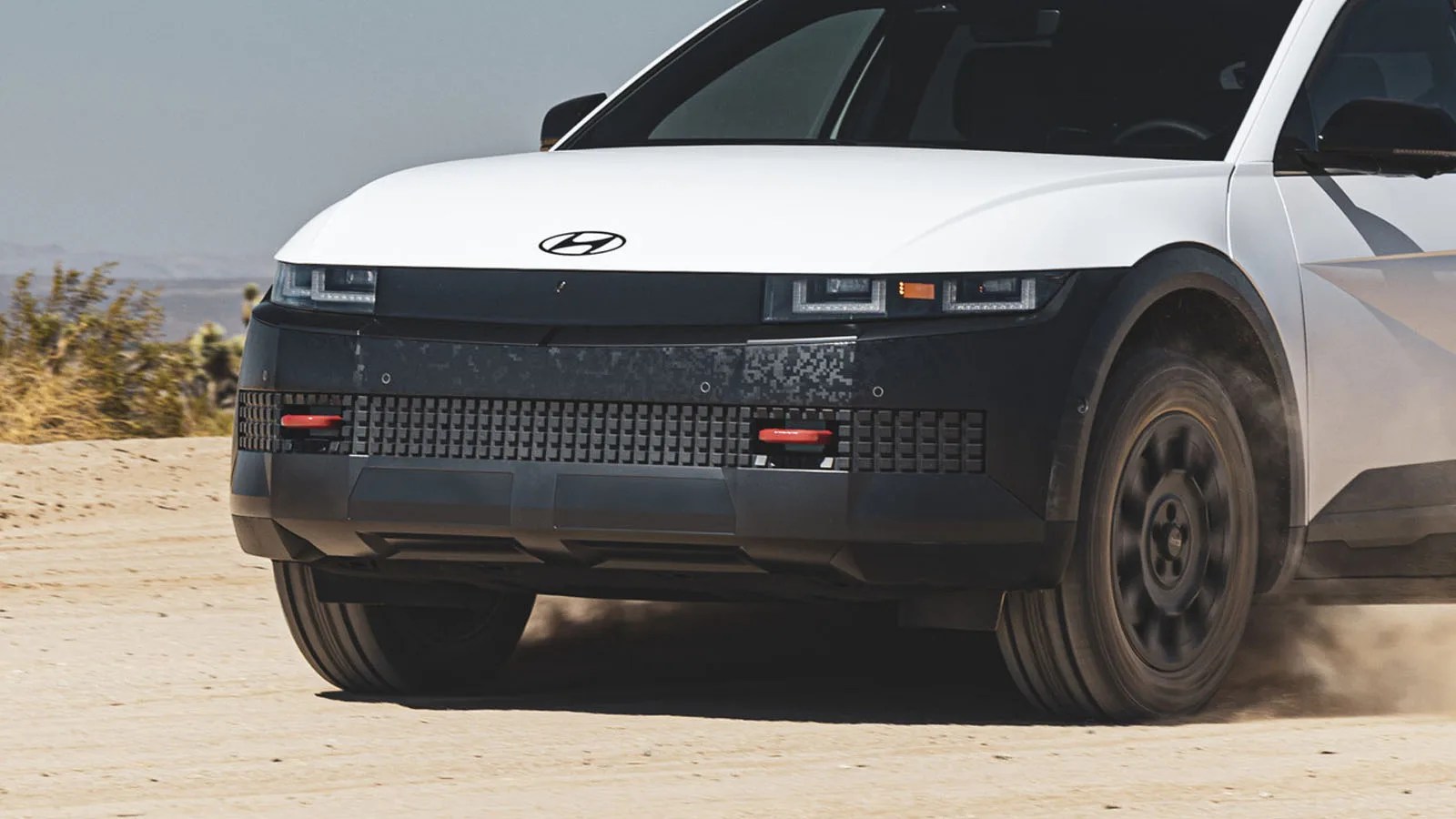 2025 Hyundai Ioniq 5 XRT Edition in white driving on a desert road