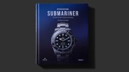 A copy of Oyster Perpetual Submariner – The Watch That Unlocked the Deep sitting on a grey background