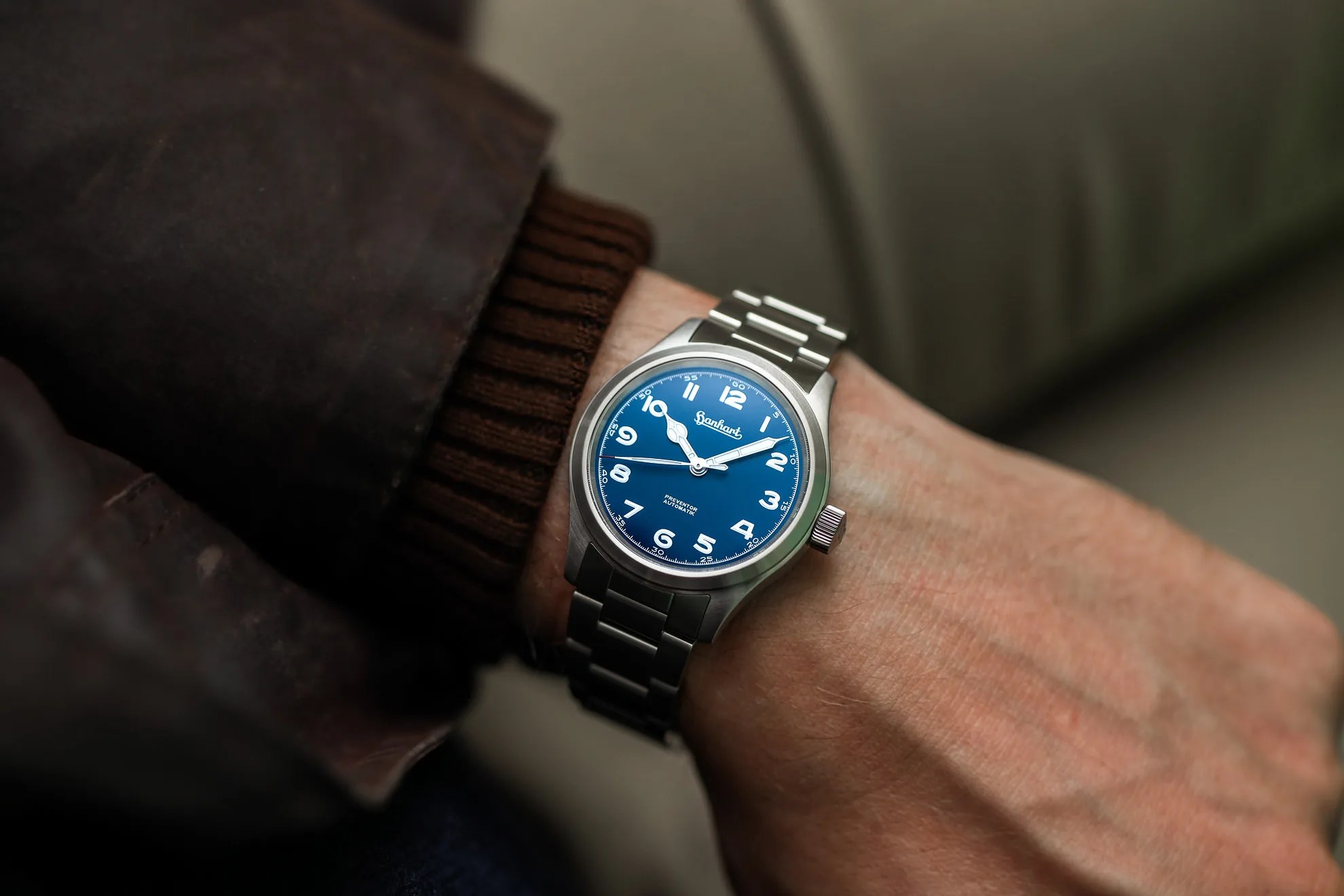 blue hanhart watch on a mans wrist