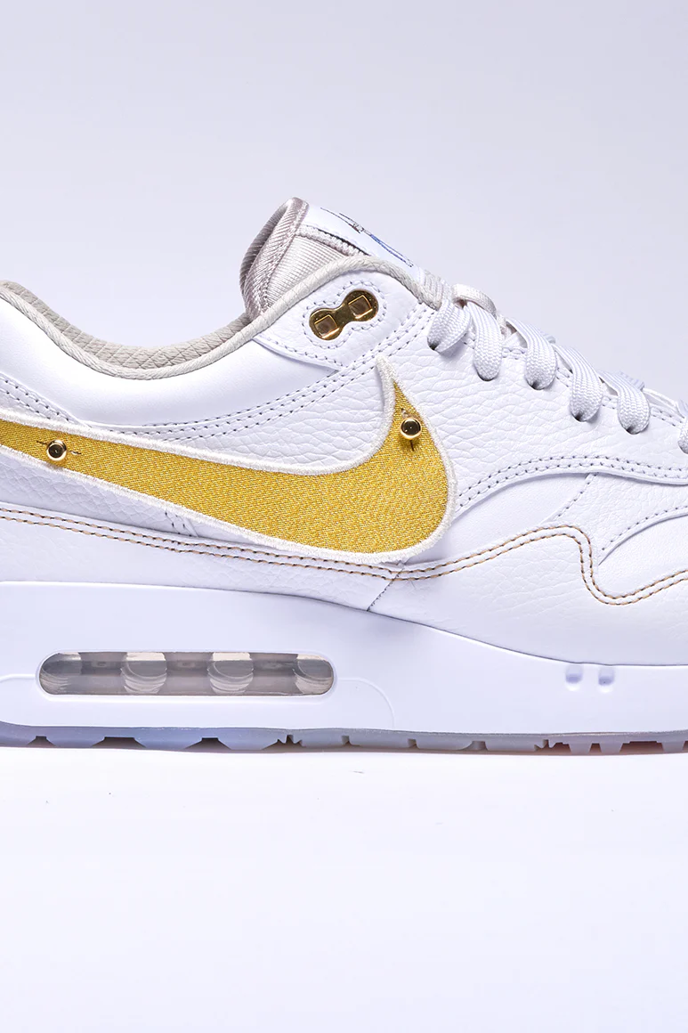 Close up of the removable swoosh in gold on the Eastside Golf x Nike Air Max 1 '86 OG'