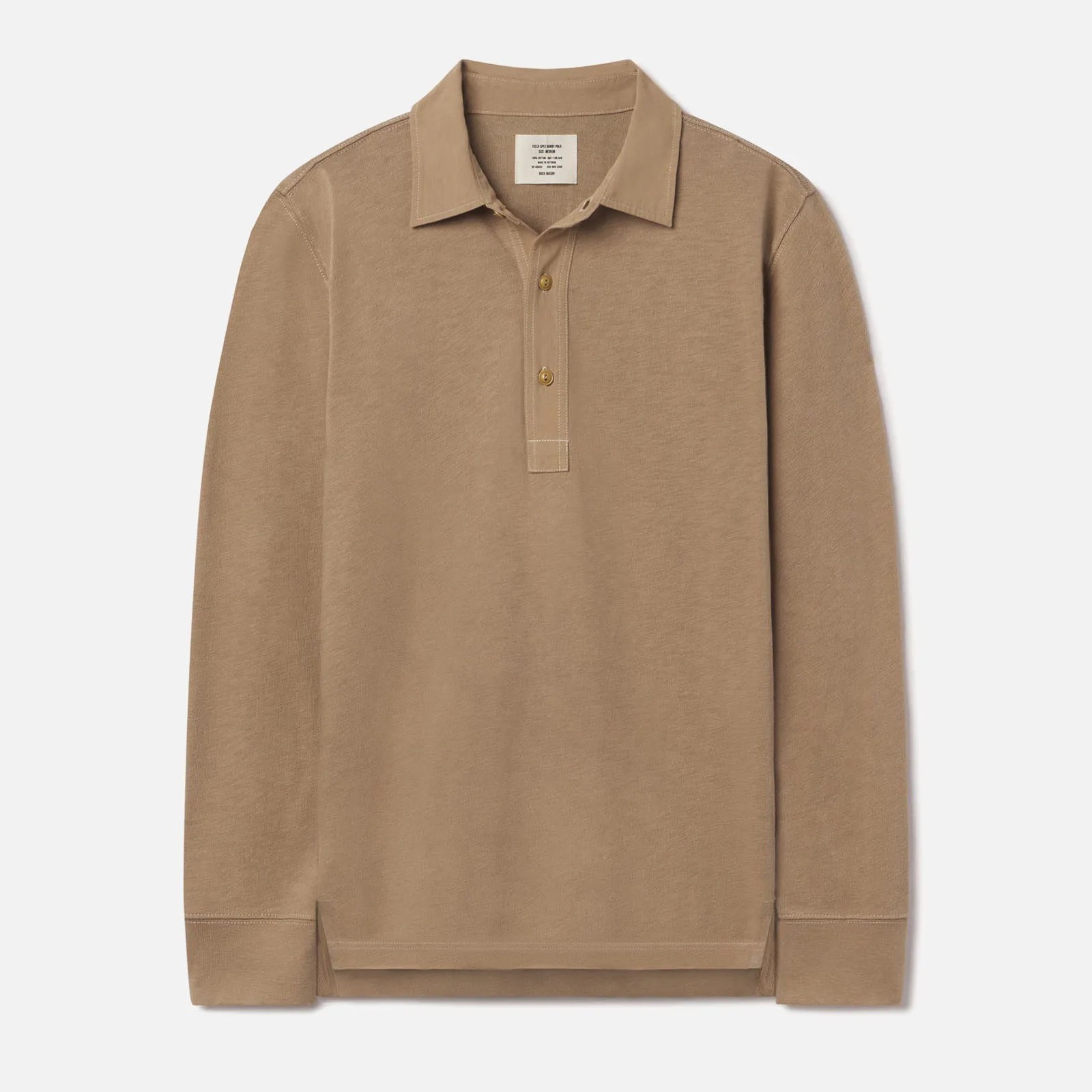 Buck Mason&rsquo;s Field Spec Rugby shirt in a tan color laid flat against a light grey background