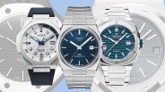 Three luxury wristwatches side by side: Citizen with white dial and black strap, Tissot with blue dial and metal bracelet, and Alpina with blue textured dial and metal bracelet.