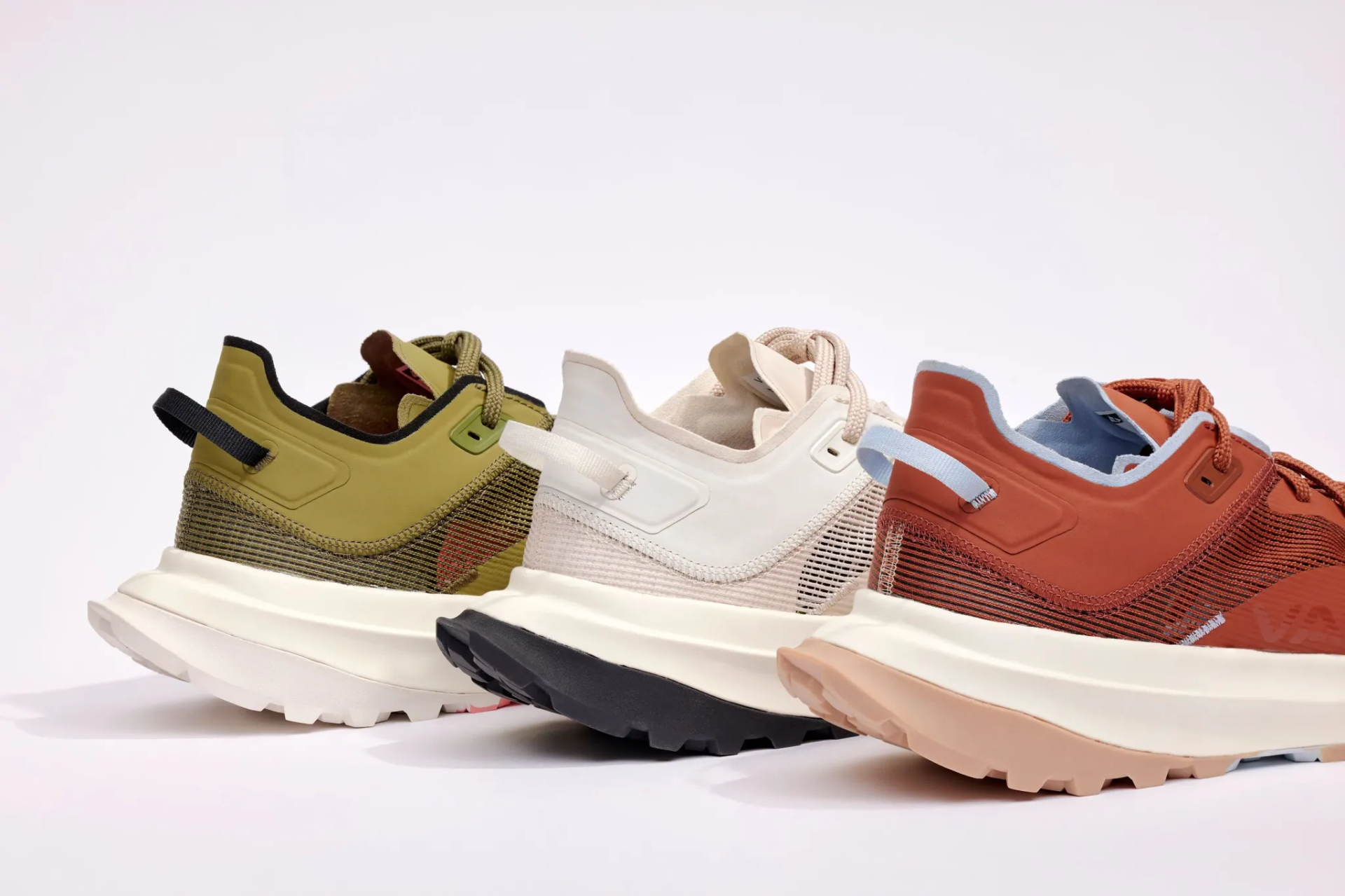 An image showing three Vasque Re:connect shoes in different colors aligned in a staggered patter n to show the heel portion of the shoe.