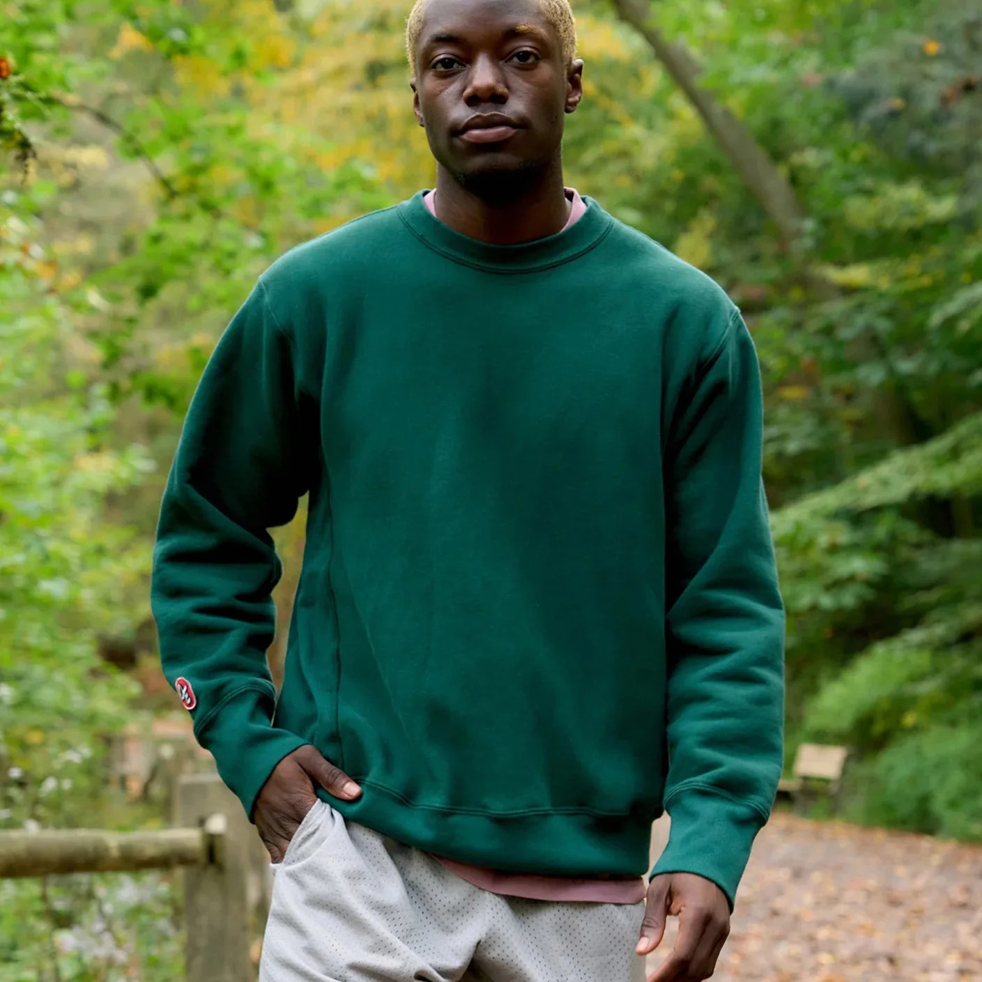 man wearing green crewneck sweatshirt