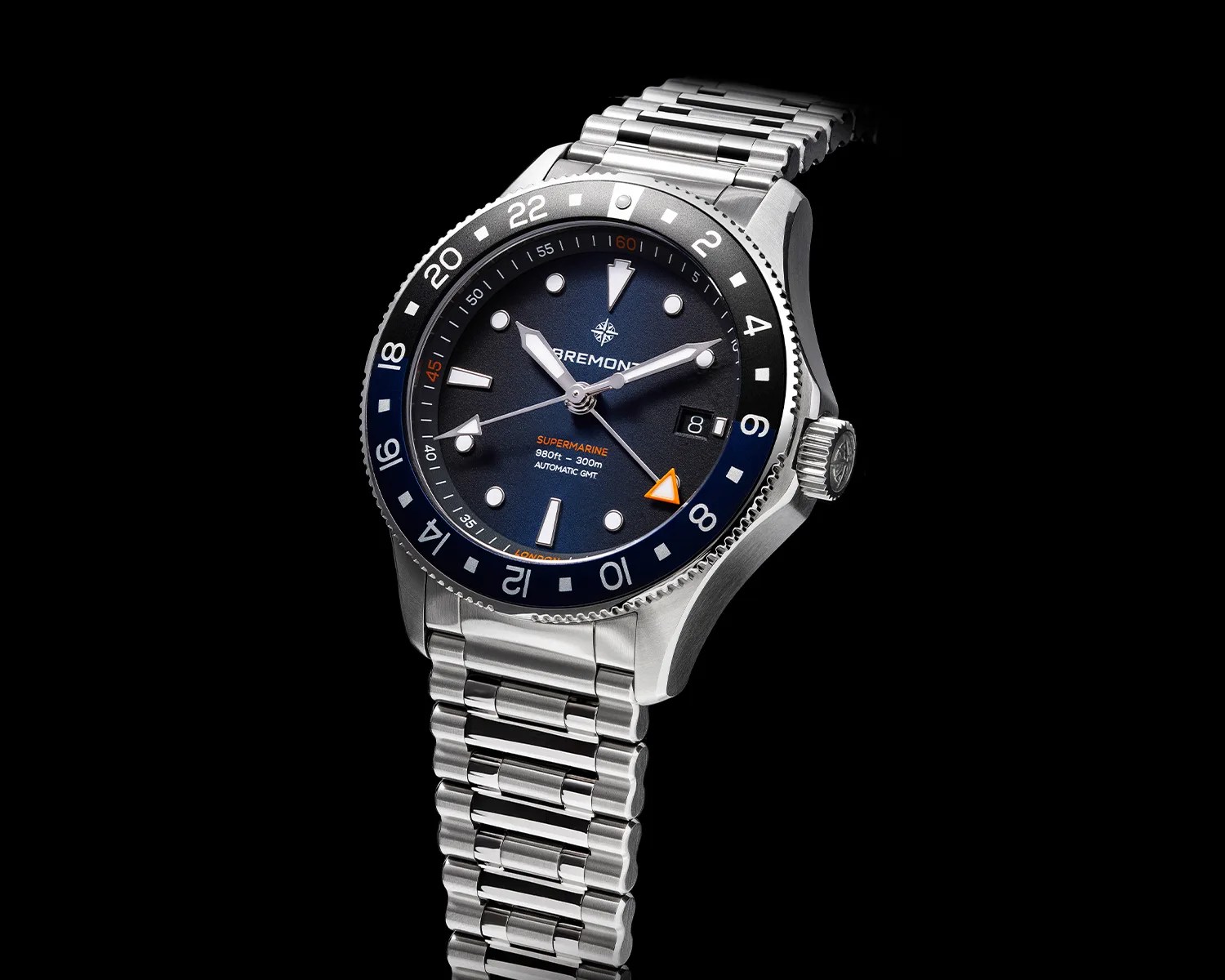 a bremont gmt dive watch against a black background