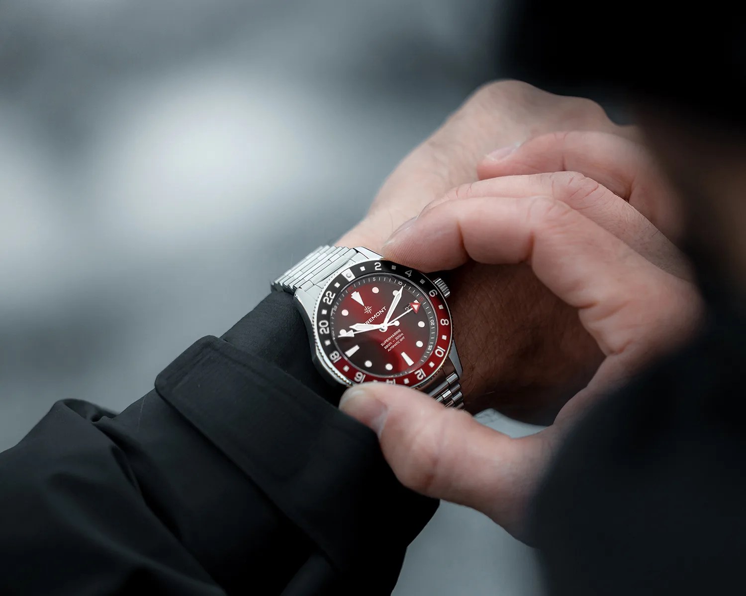 a bremont gmt dive watch on a mans wrist