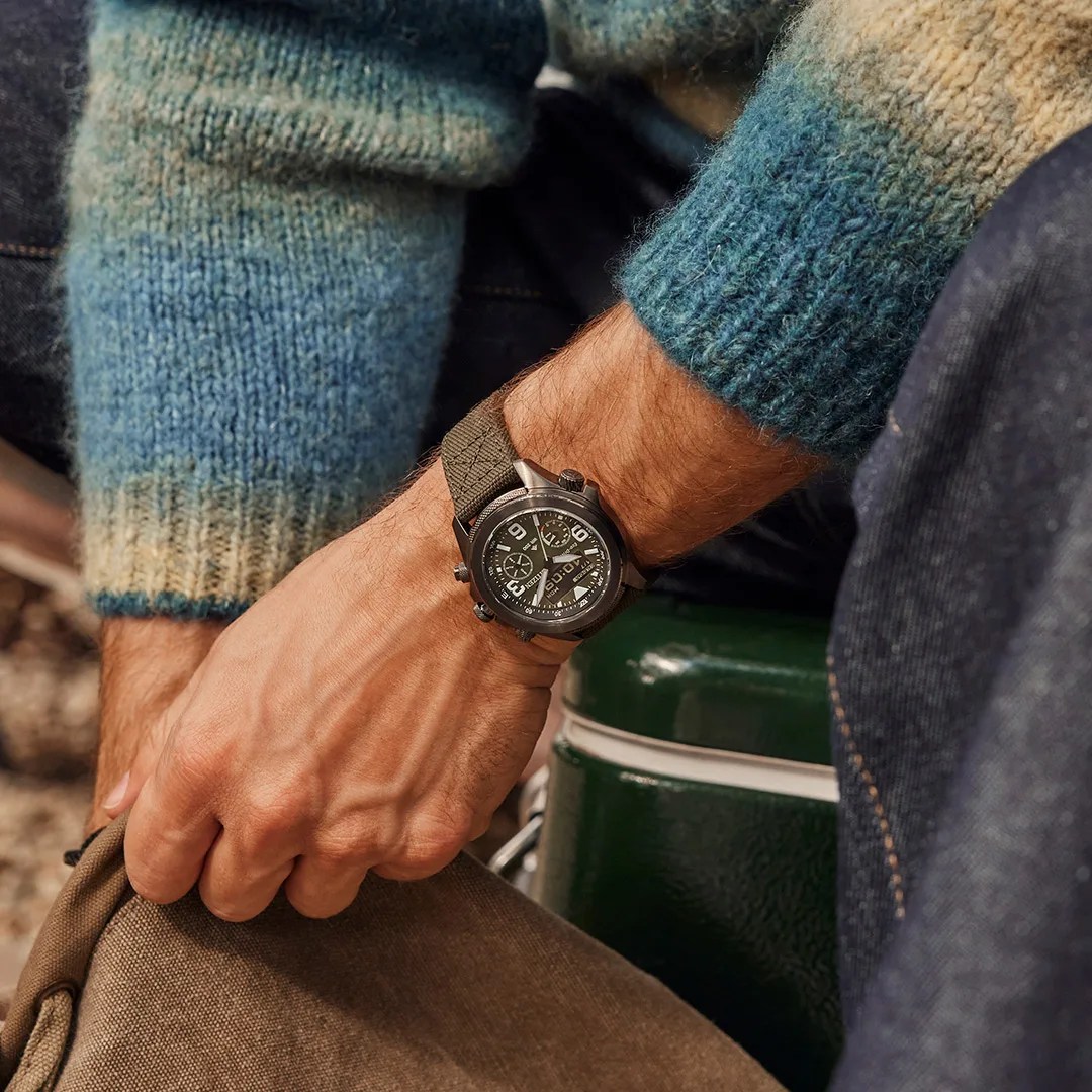 citizen watch on mans wrist