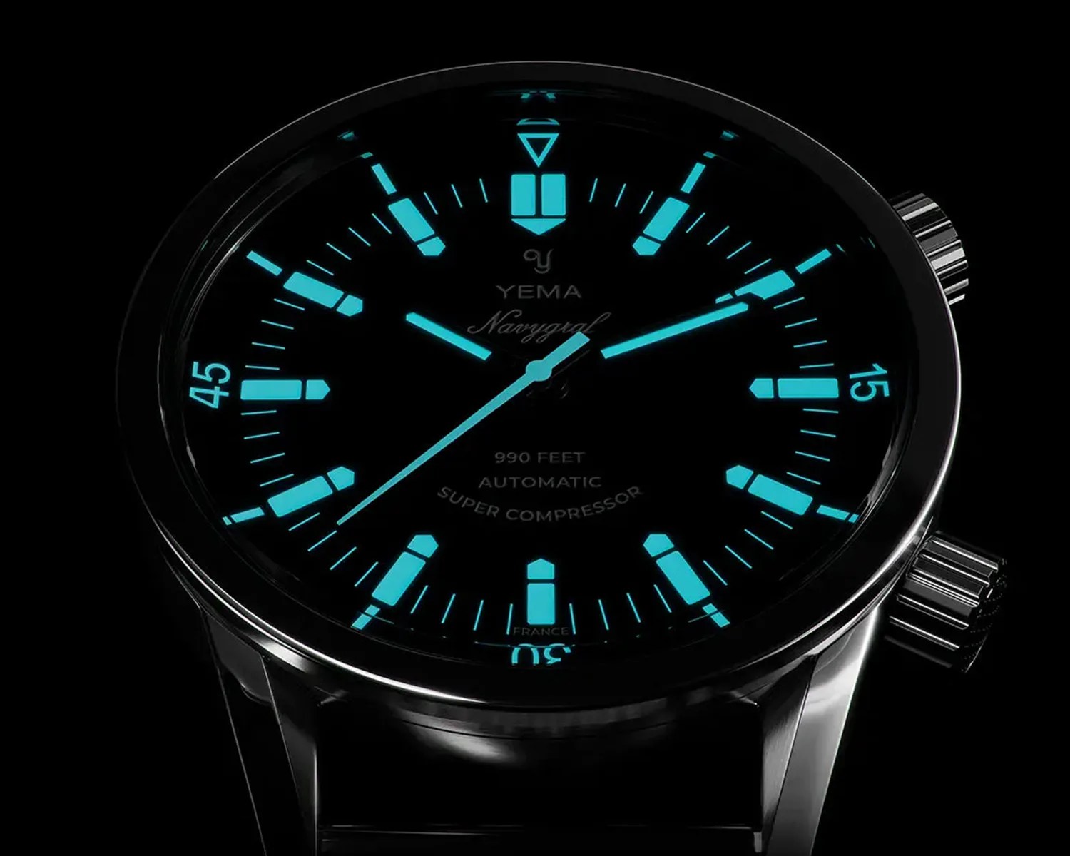 a yema super compressor dive watch glowing in the dark