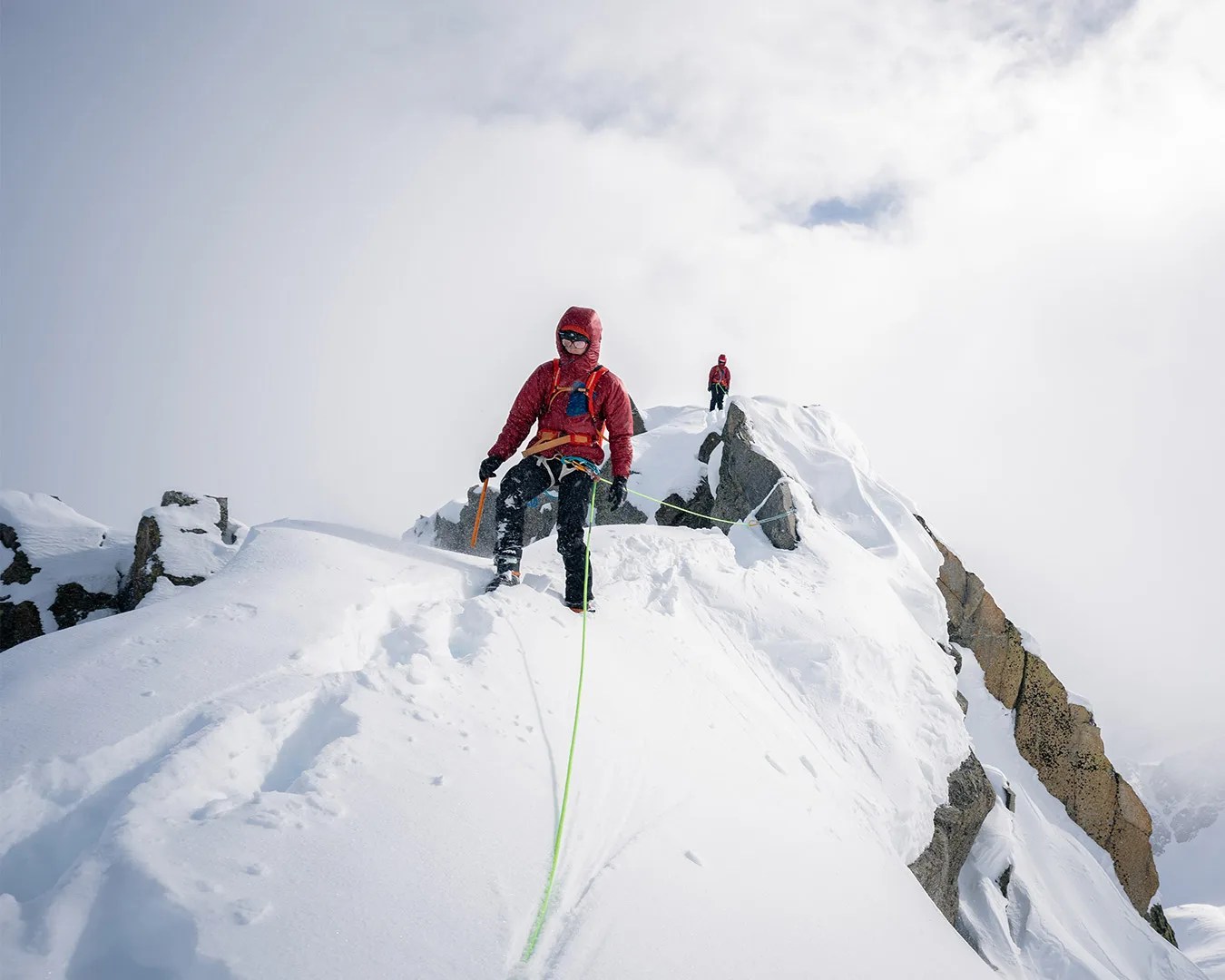 man on snowing mountain wearing Mountain Equipment Oreus Jacket