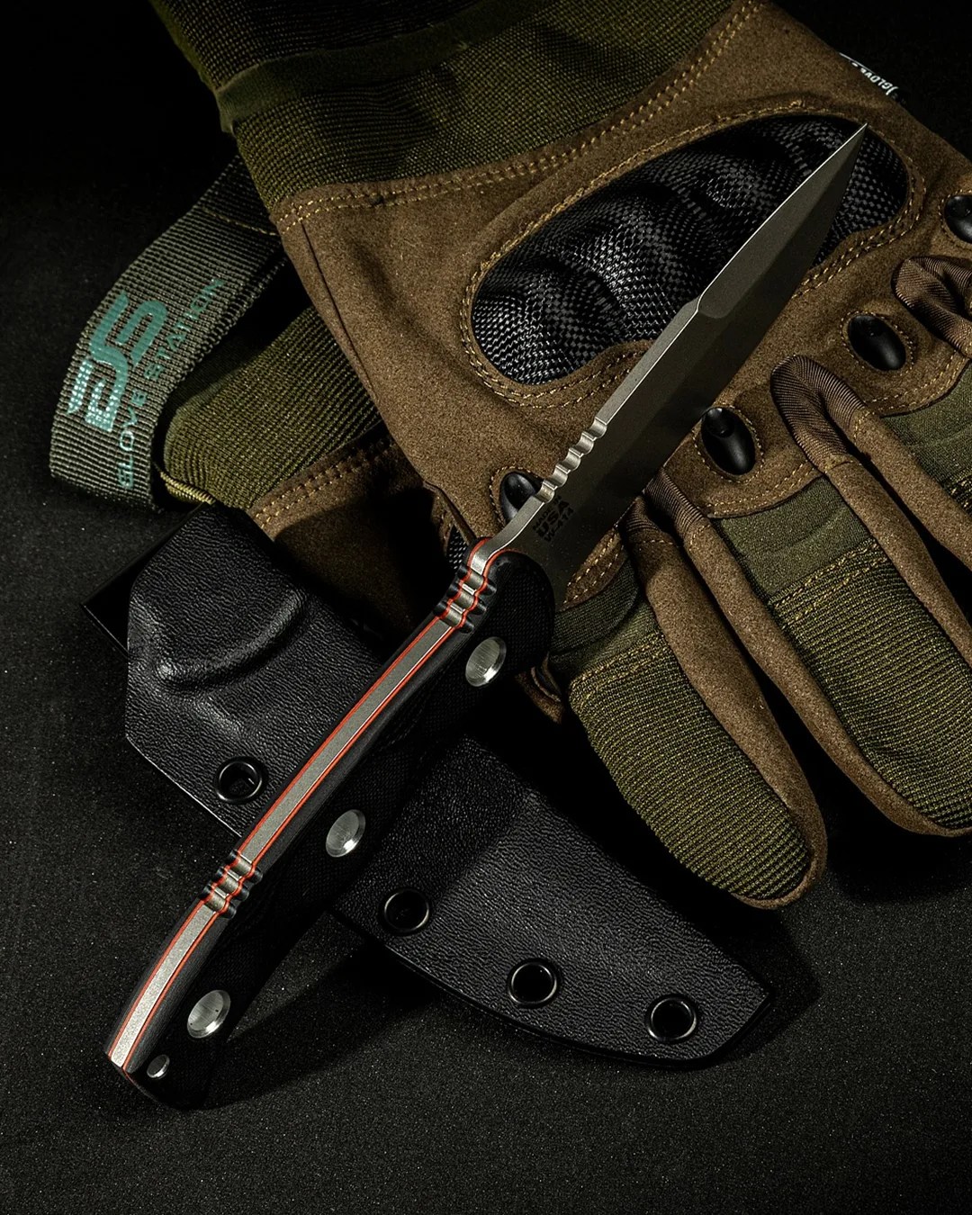 Al Mar x Tops SERE Operator knife laying on tactical gloves and sheath