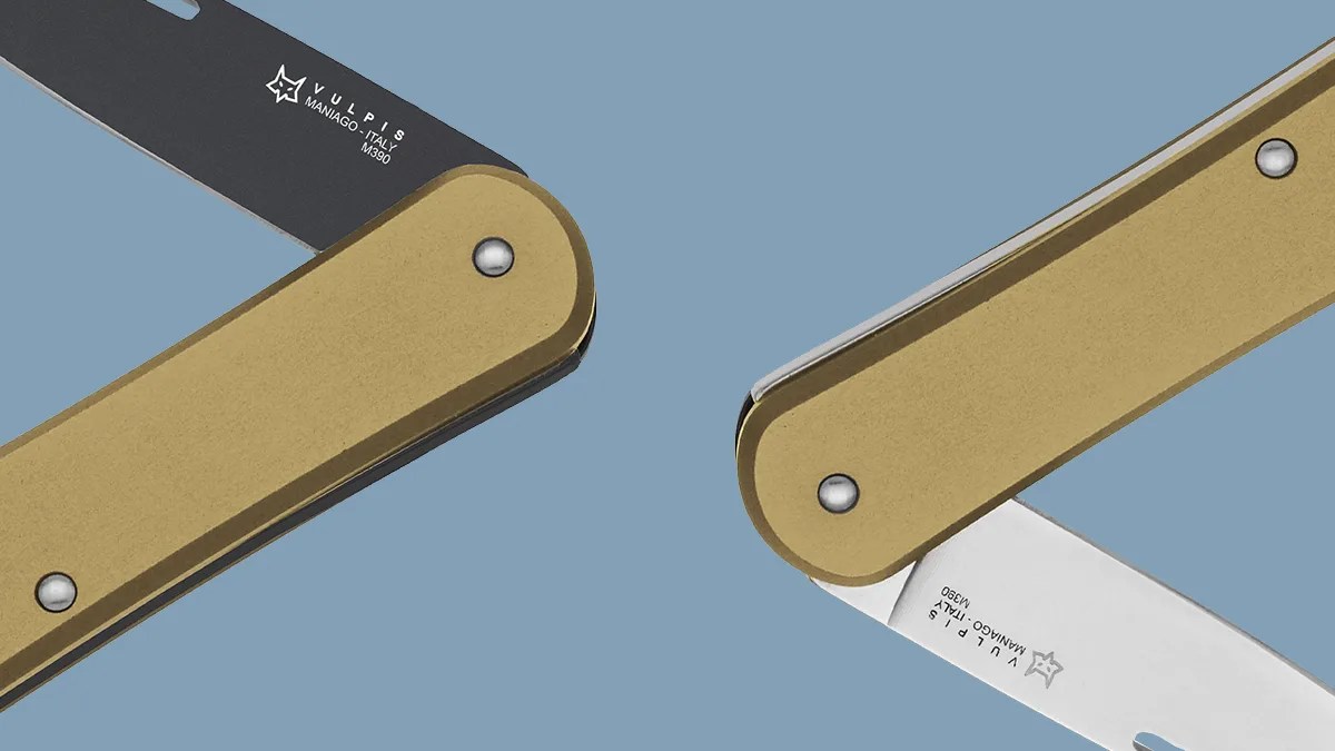 Fox Vulpis knives macro on blue background