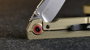 Oknife XEN-OAL knife pivot closeup on black felt