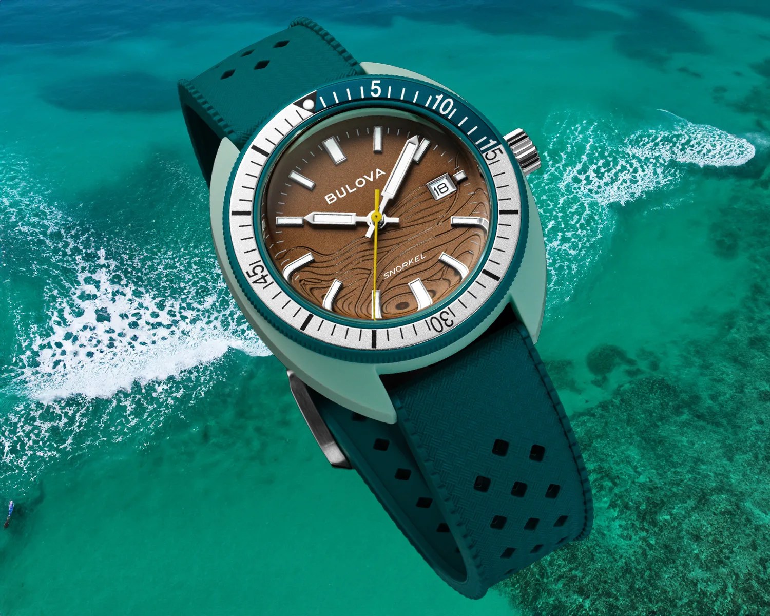 a Bulova dive watch superimposed over the ocean