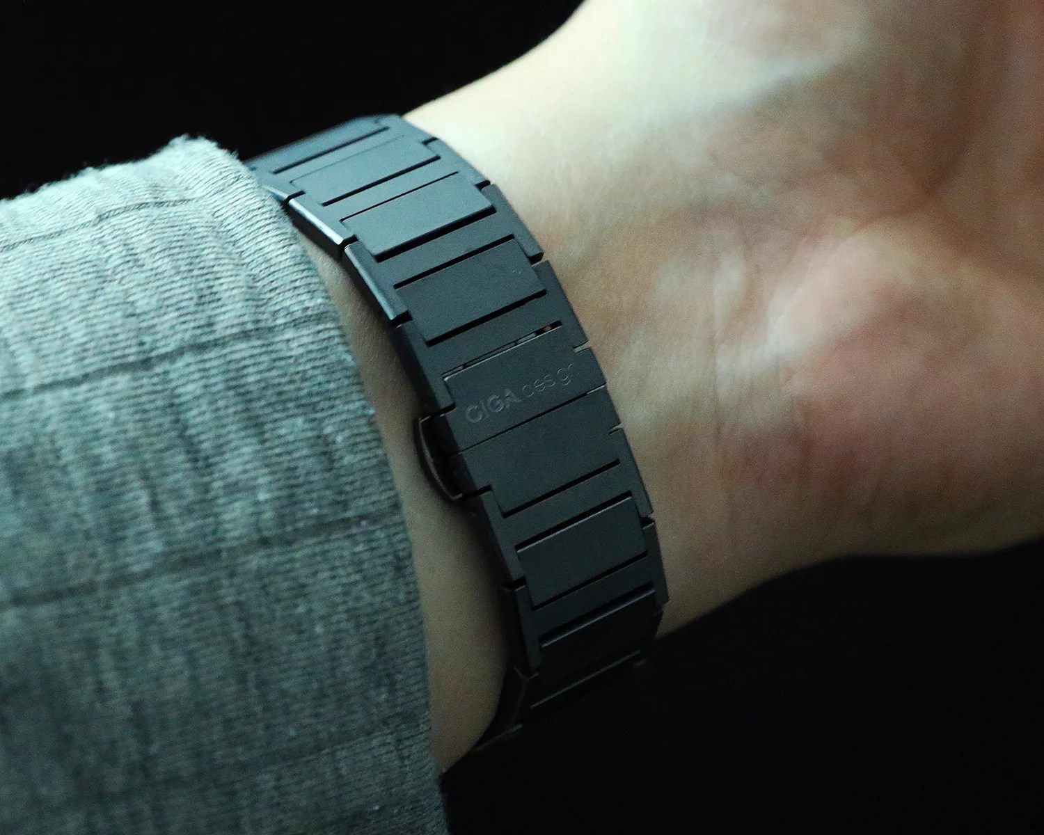 the clasp of a a ciga design watch bracelet on a mans wrist